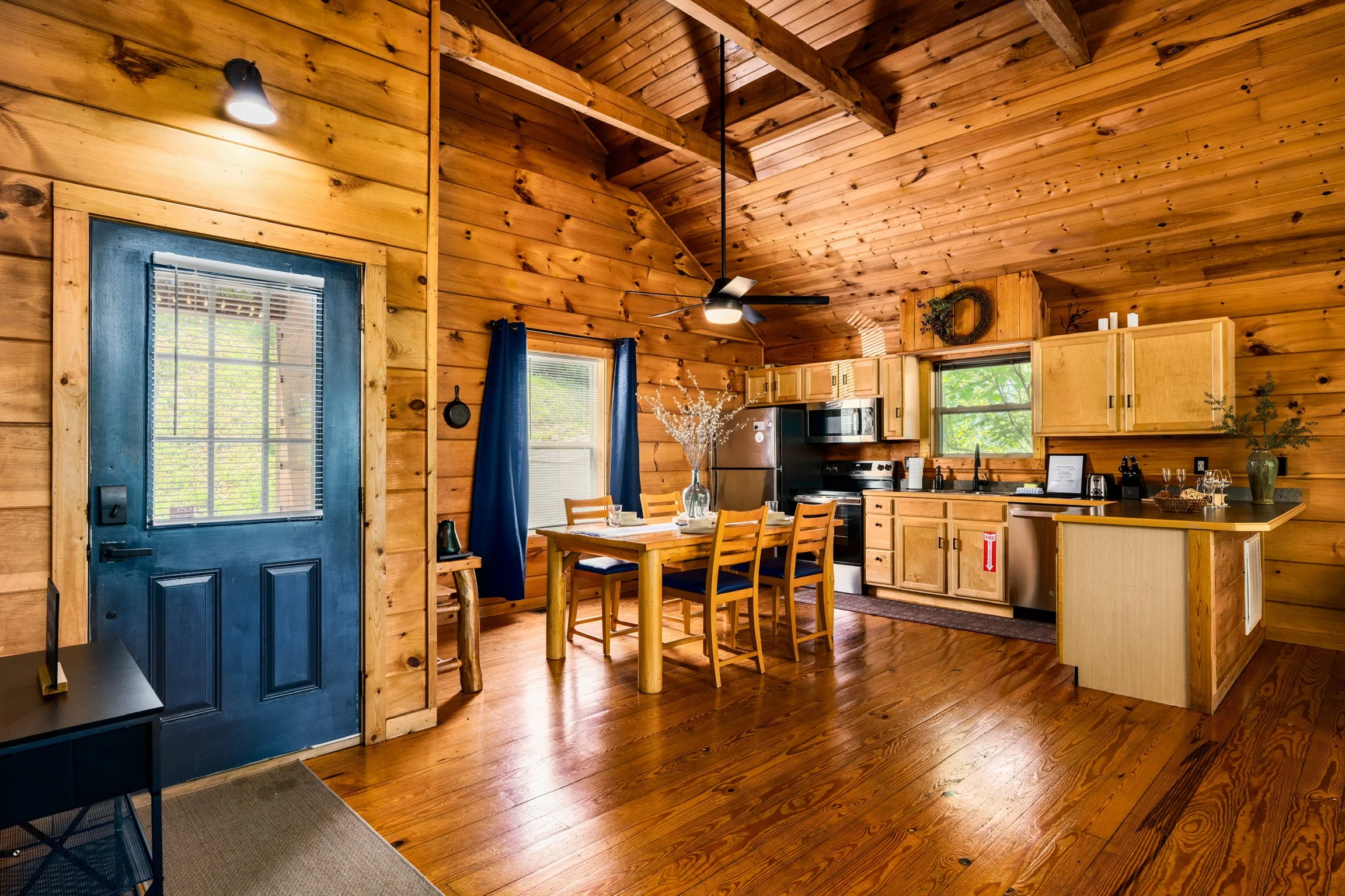 Blue Sage Hideaway entryway with blue door and dining table view