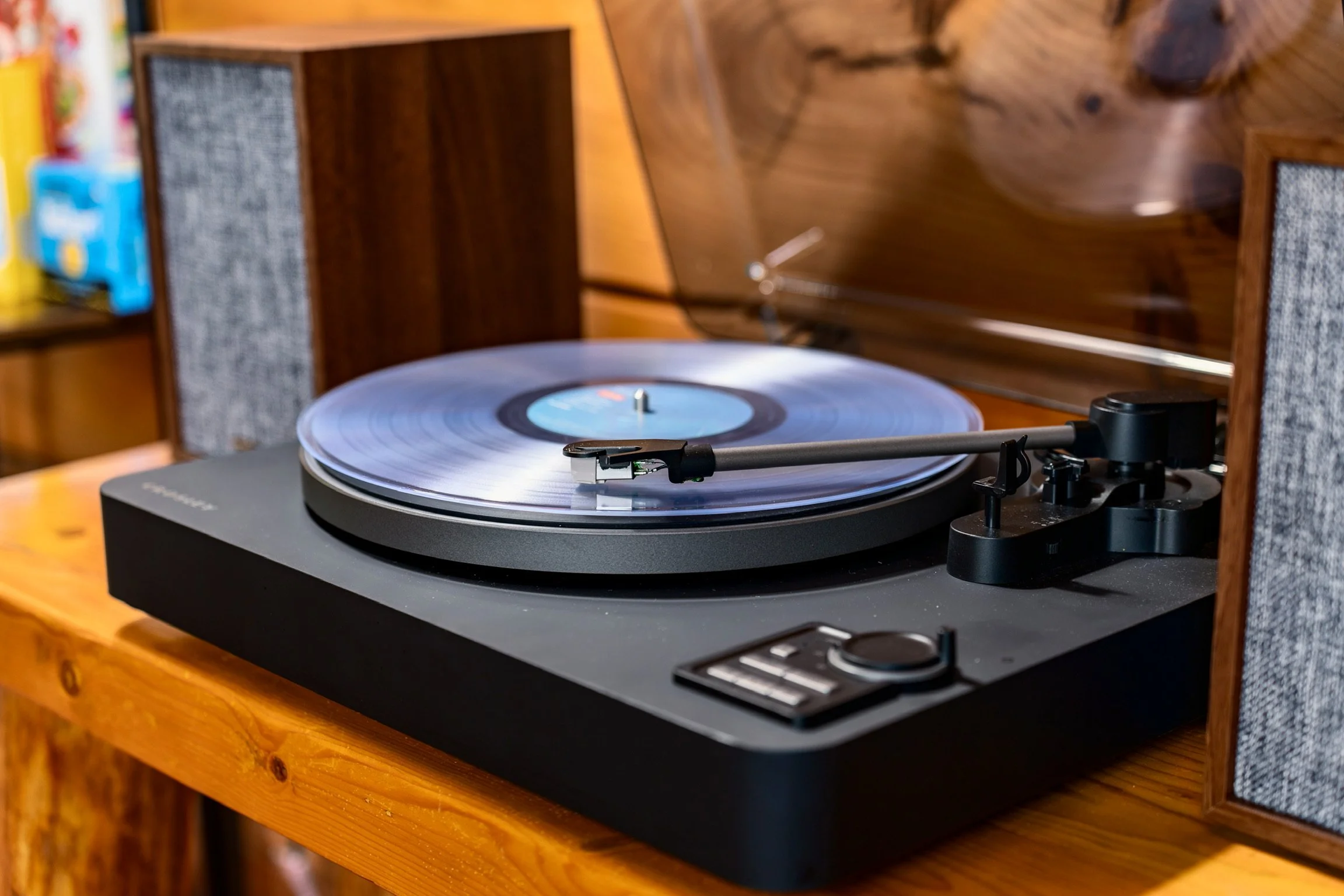 Blue Sage Hideaway record player and vinyl on entertainment stand