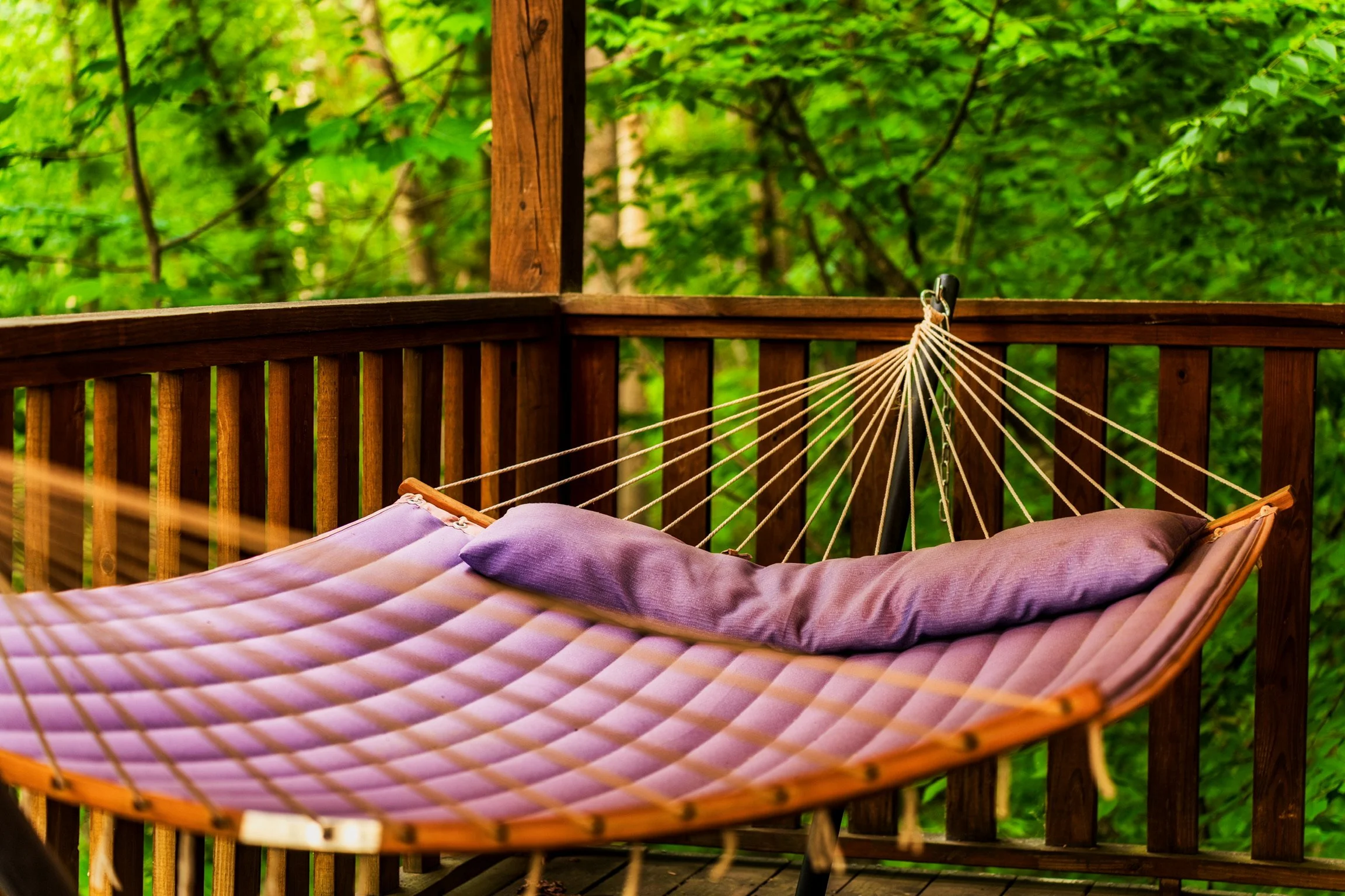Blue Sage Hideaway lower level balcony hammock on covered deck 