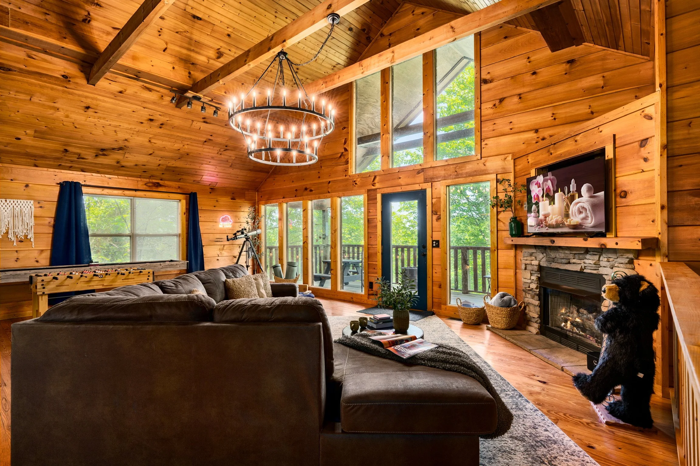 Blue Sage Hideaway living room wide shot with chandelier and game tables