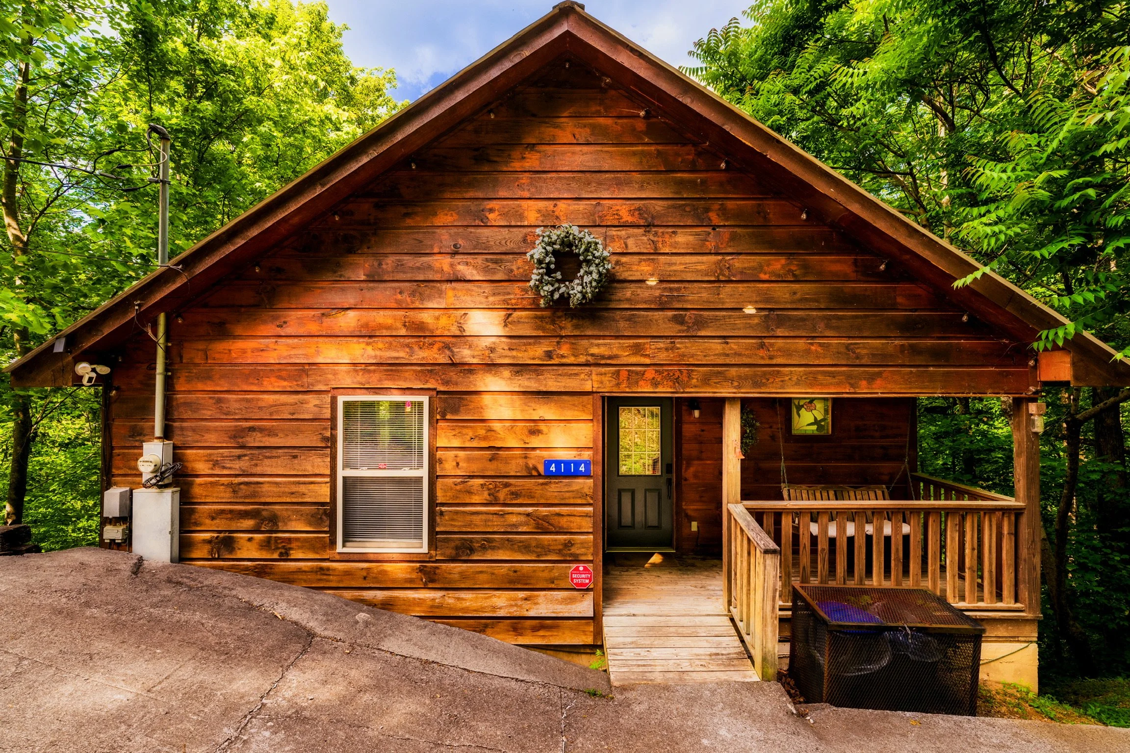 Blue Sage Hideaway Sevierville TN cabin exterior with wreath on front door