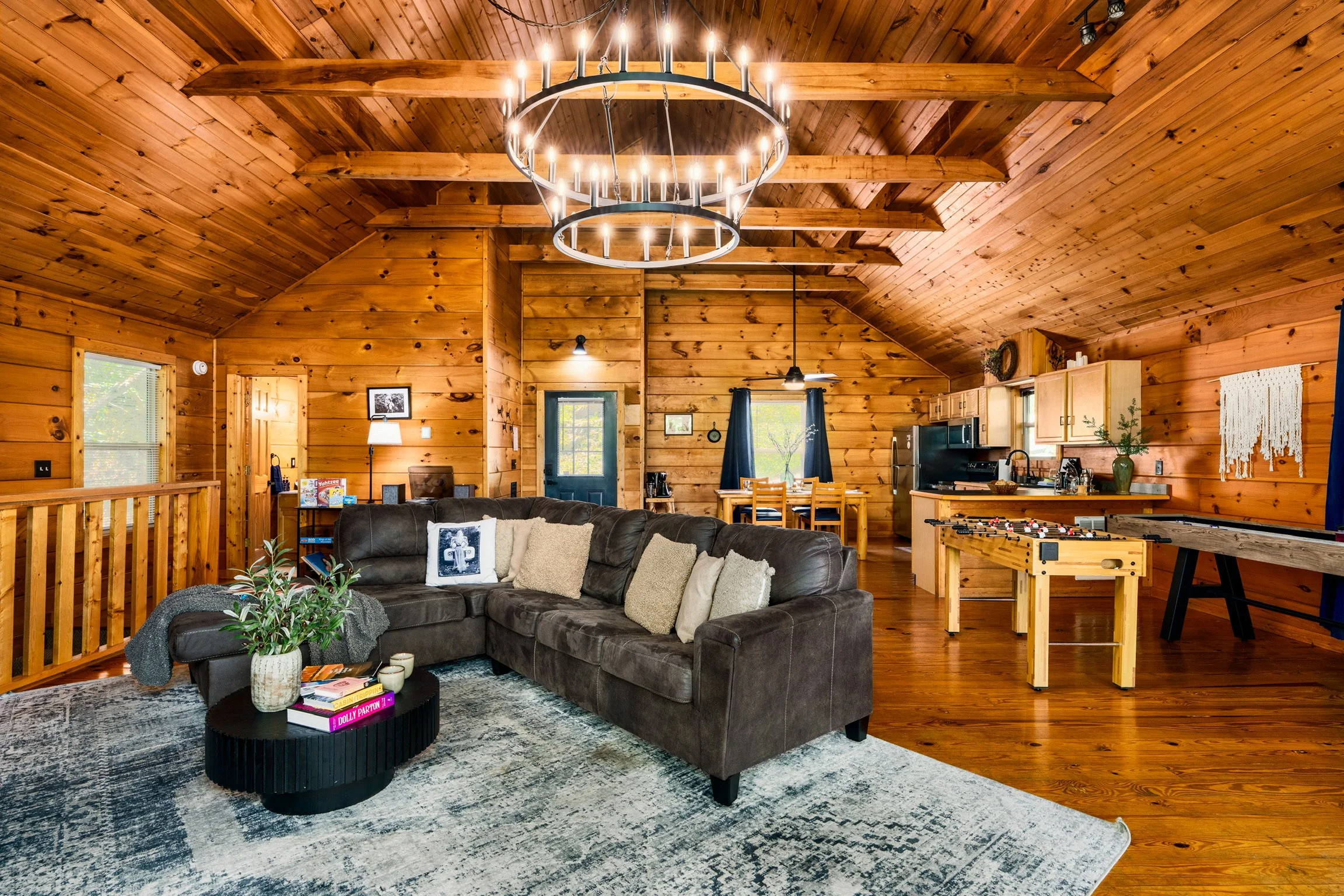Blue Sage Hideaway living room with chandelier, wide interior view 