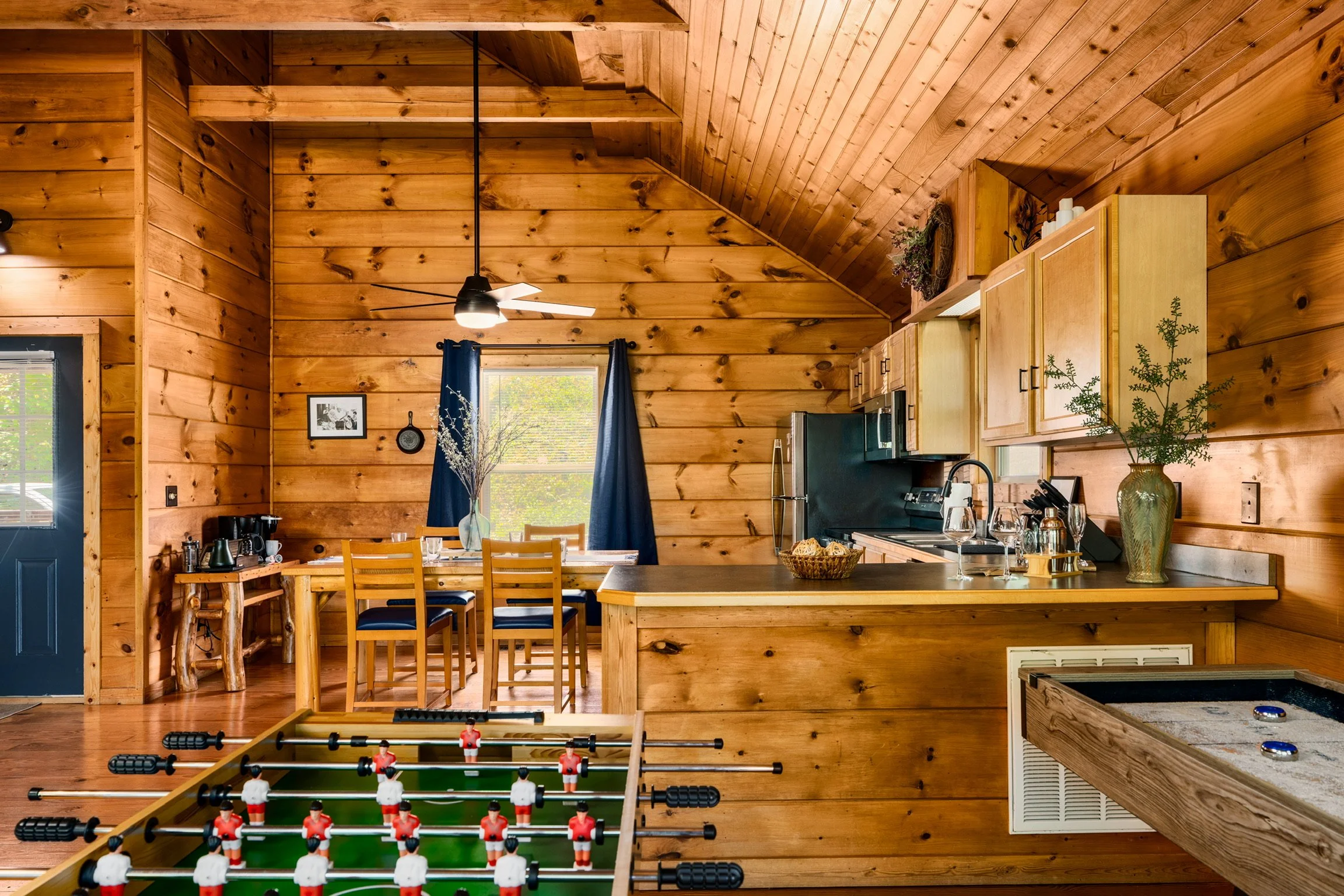 Blue Sage Hideaway kitchen bar and game area foosball table