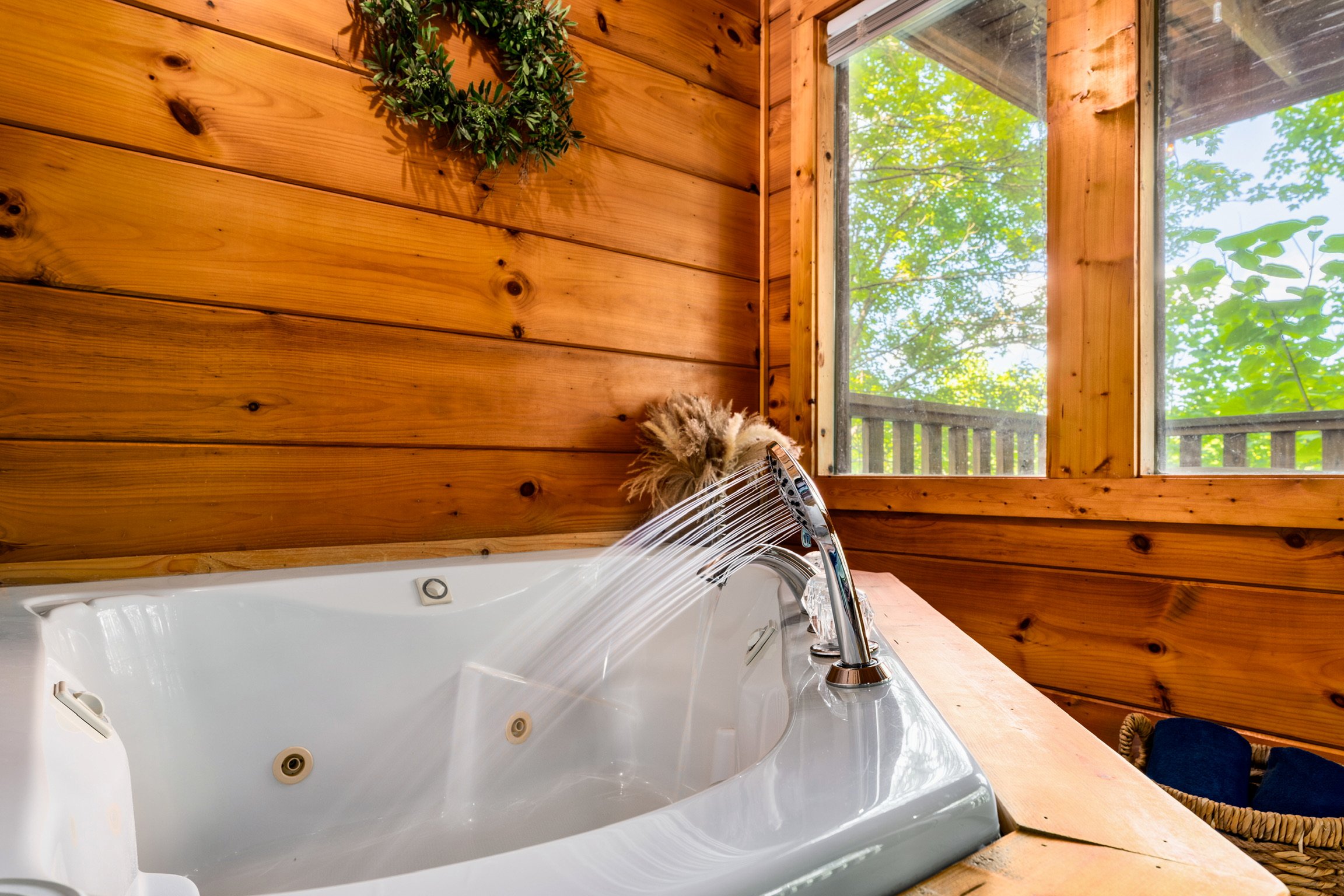 Blue Sage Hideaway jacuzzi tub with handheld shower head