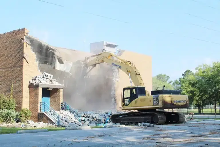CIDS excavator performing total building demolition