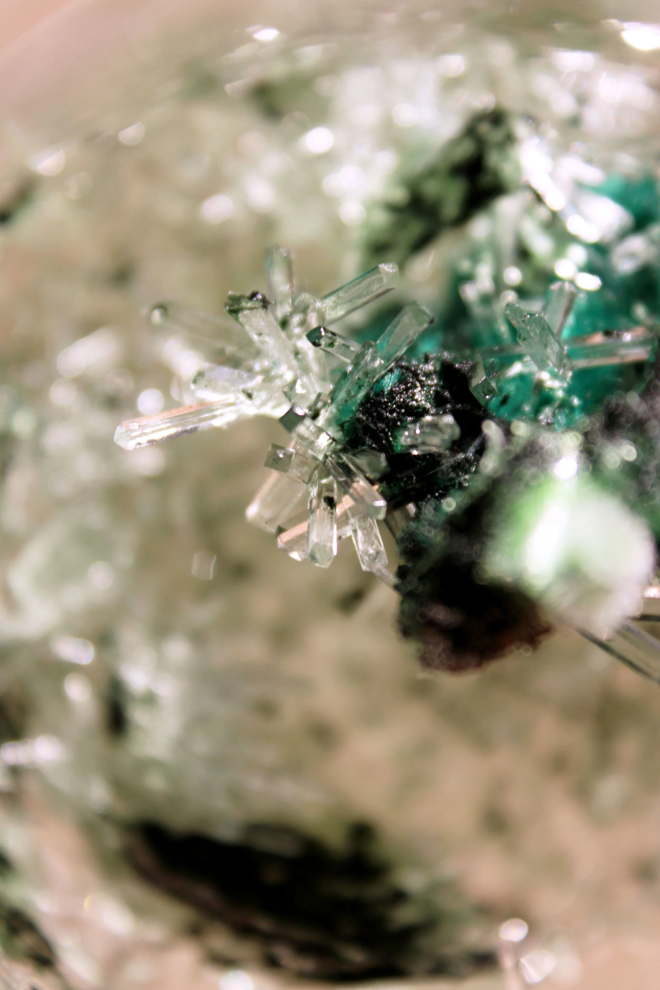 Close-up of snowflake crystals on a surface.