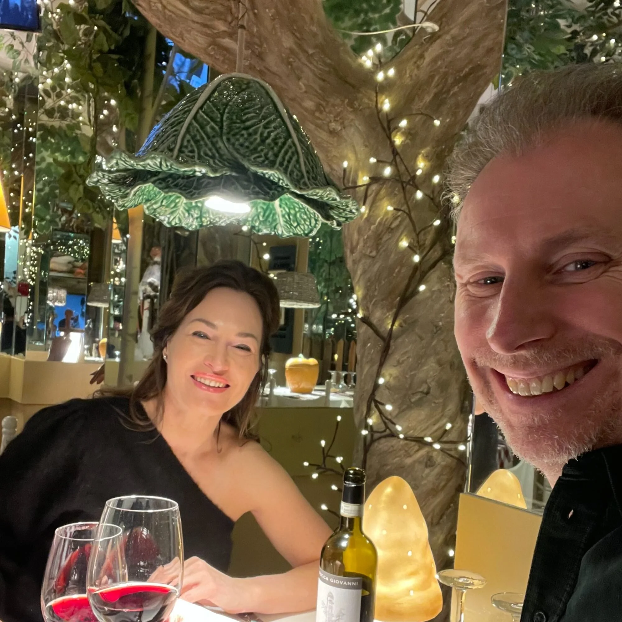 Hans and Karin sharing wine at a restaurant in Turin