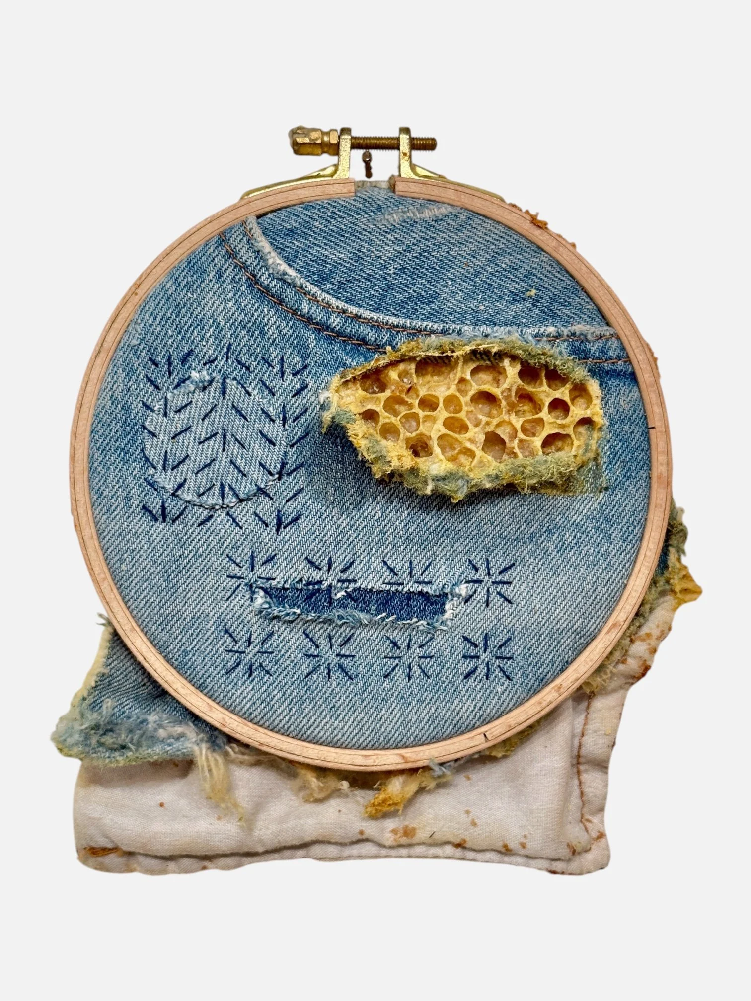  Sashiko Denim, Mended 
Repurposed denim, sashiko thread and honeycomb in embroidery hoop