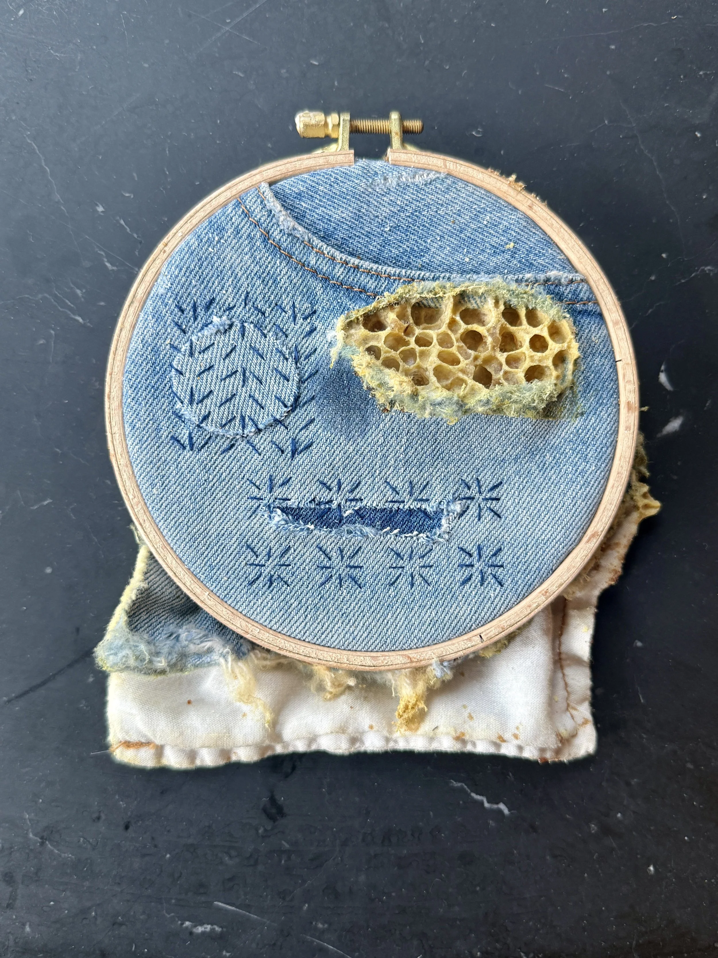  Sashiko Denim, Mended 
Repurposed denim, sashiko thread and honeycomb in embroidery hoop