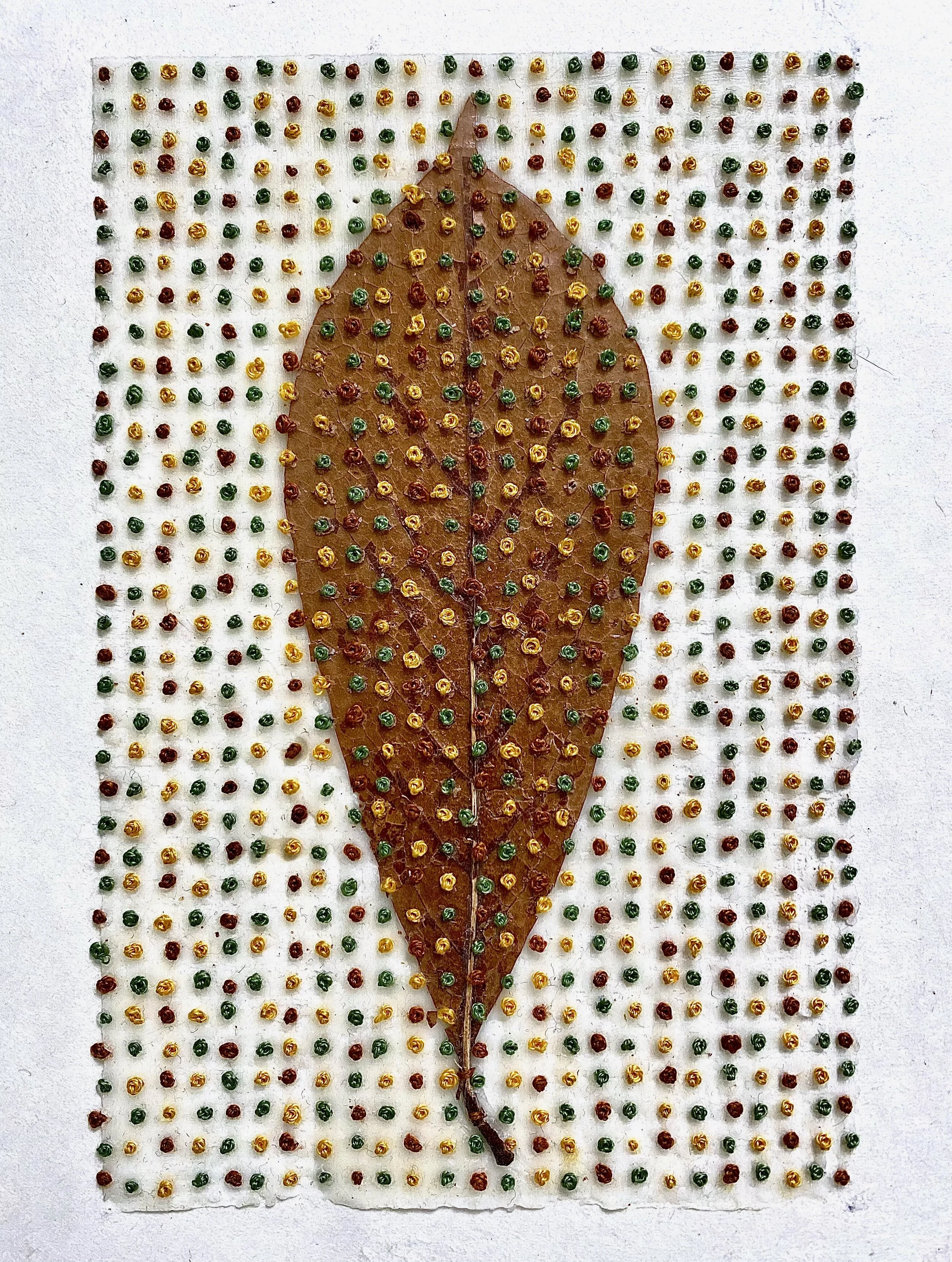  Tulip Leaf on French Knots on Paper 
Japanese paper, beeswax, Tulip leaf and embroidery floss