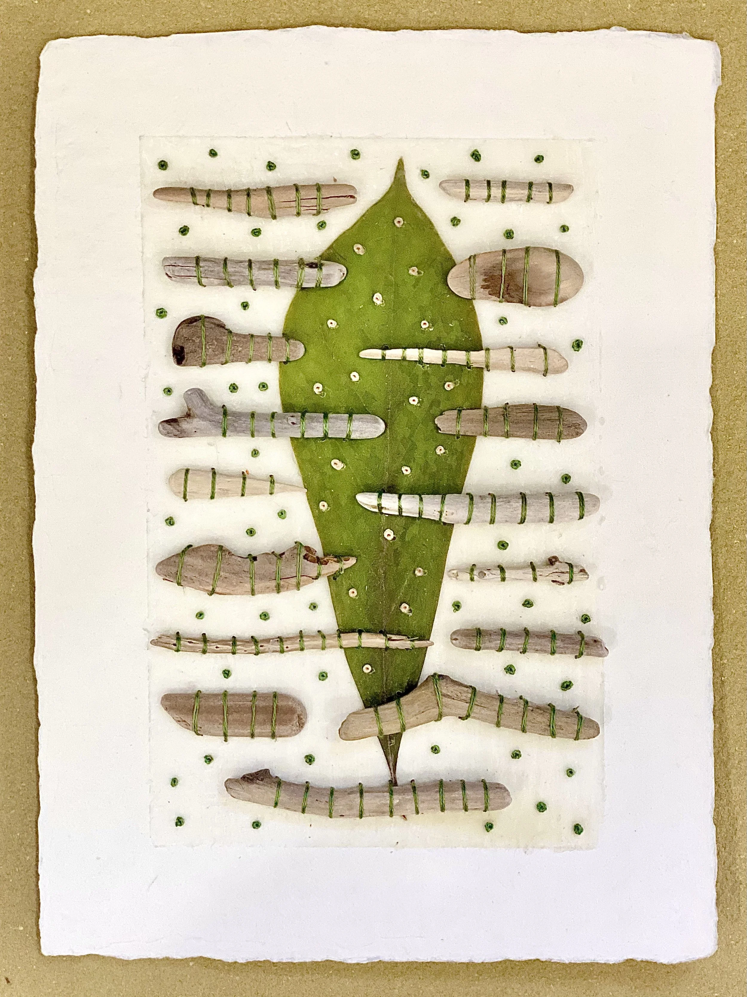 vTulip Leaf and Driftwood on Paper 
Japanese paper, beeswax, Tulip leaf, mini driftwood,  and embroidery floss