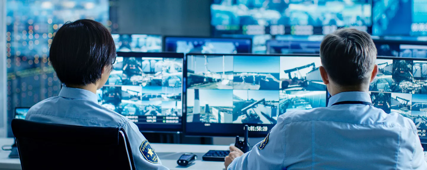 Security team monitoring surveillance systems