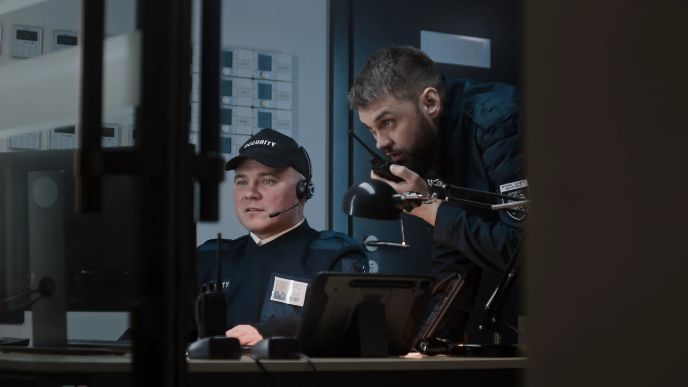 Security professionals reviewing surveillance systems