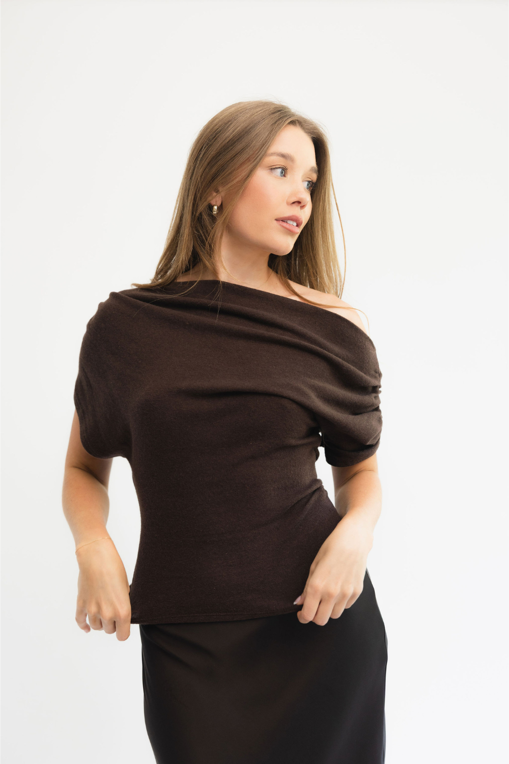 Headshot of Megan, Los Angeles wedding videographer and founder of Saltrock Studios, in a brown top.