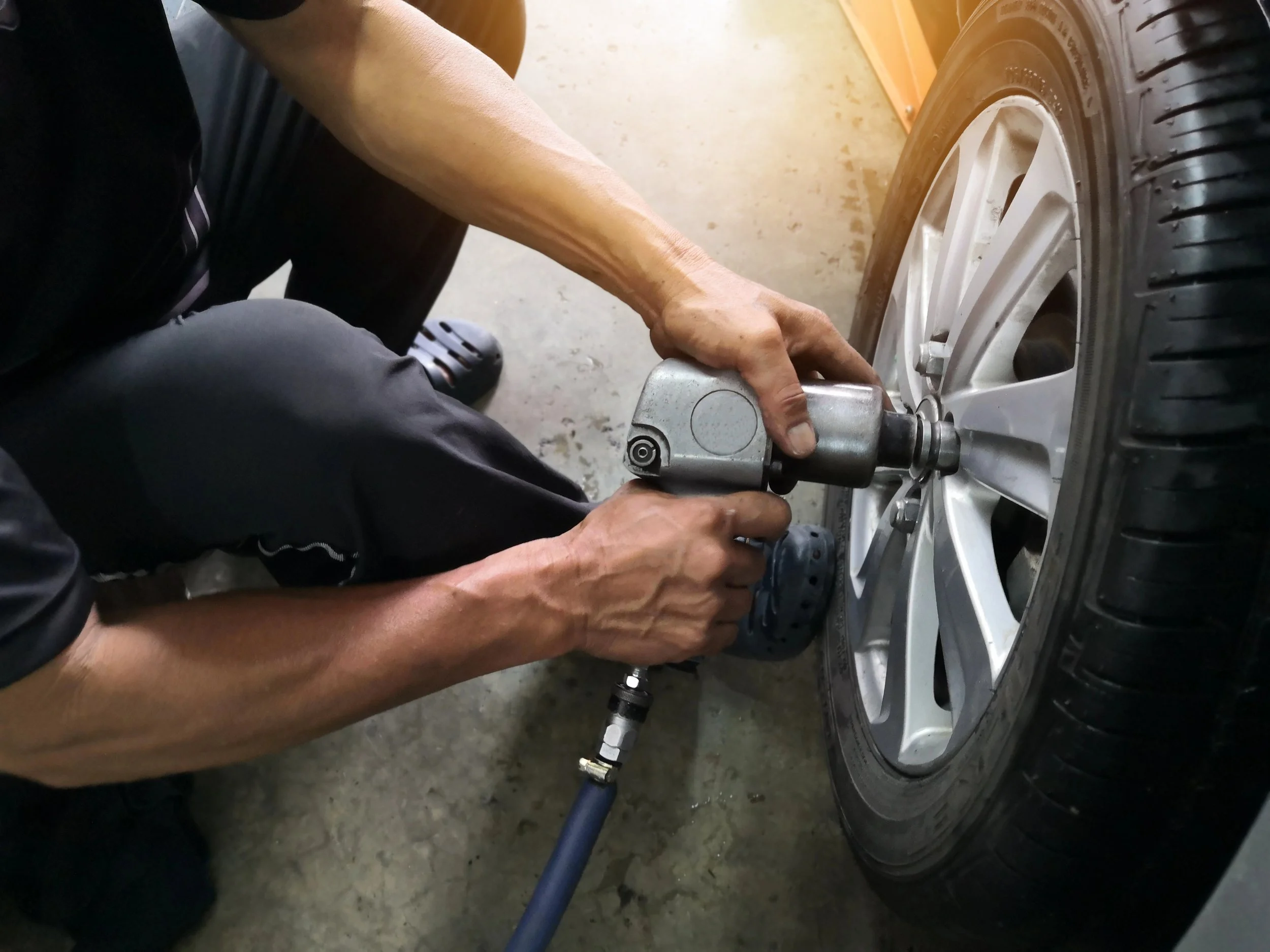 Mechanic changing tire