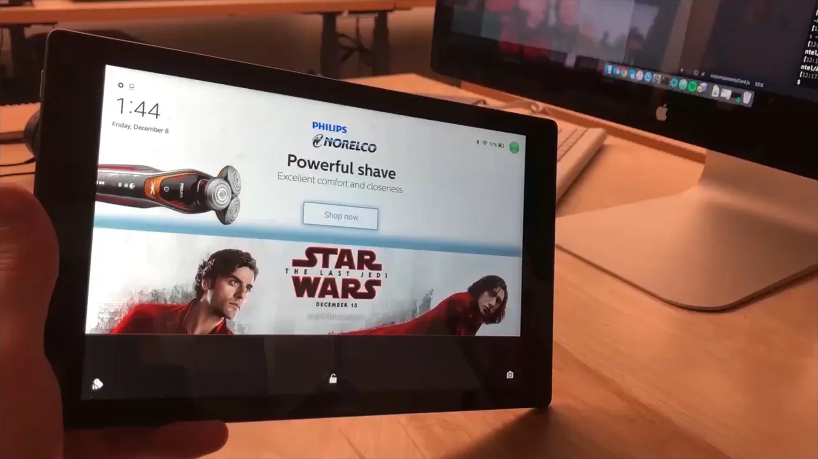 Tablet displaying advertisements, including a Philips electric shaver with a 'Shop now' button, and a promotional poster for 'Star Wars: The Last Jedi' with release date December 15.