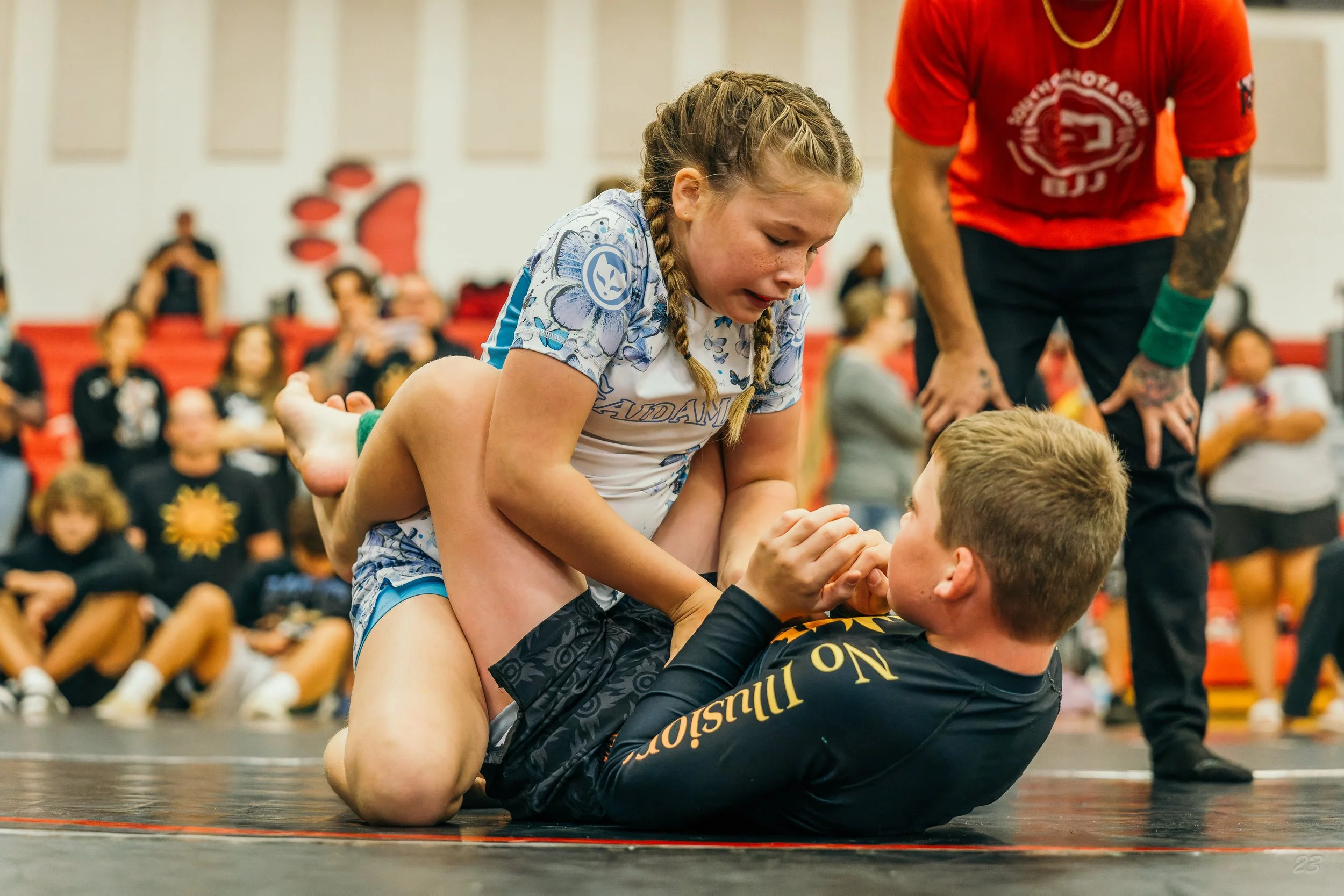 Two youth Brazilian jiu-jitsu competitors grapple in a no-gi match at the South Dakota Open.