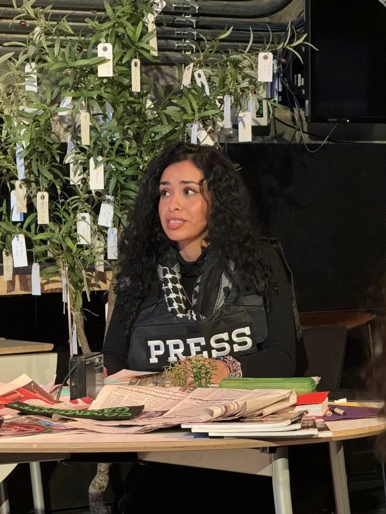 HQ THEATRE, Toronto, ON: Storyteller Chris el-Kholy reviews military drone spending after sifting through research on her desk in a scene from Living with Drones.
