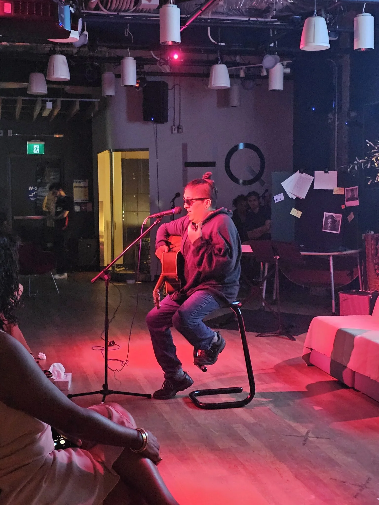 Storysharer Damian Krypt shares a song with the audience as the show comes to a close