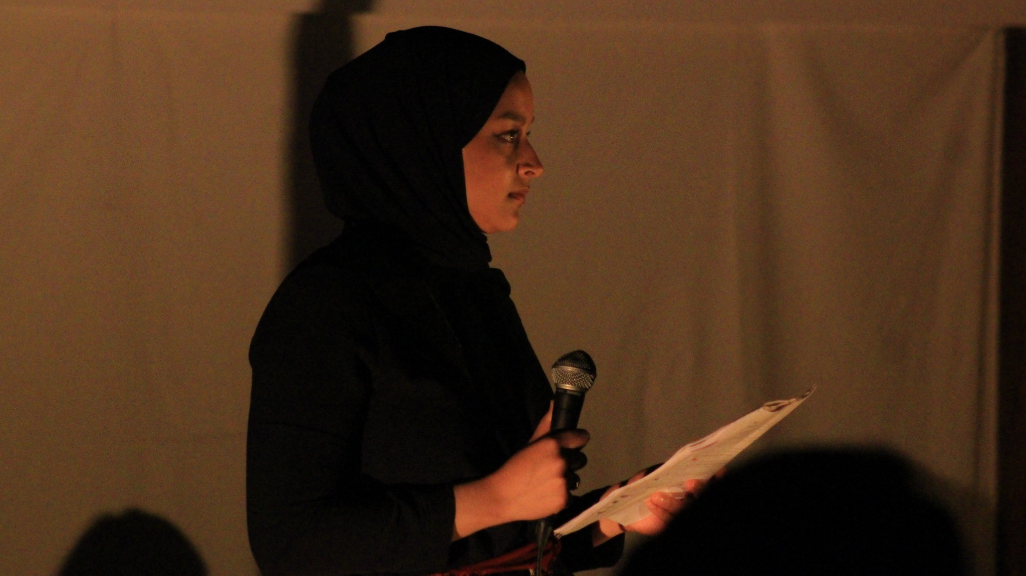 Saman Dara of stitched! performs "Letter from Battir". Photo by Amber Ranson
