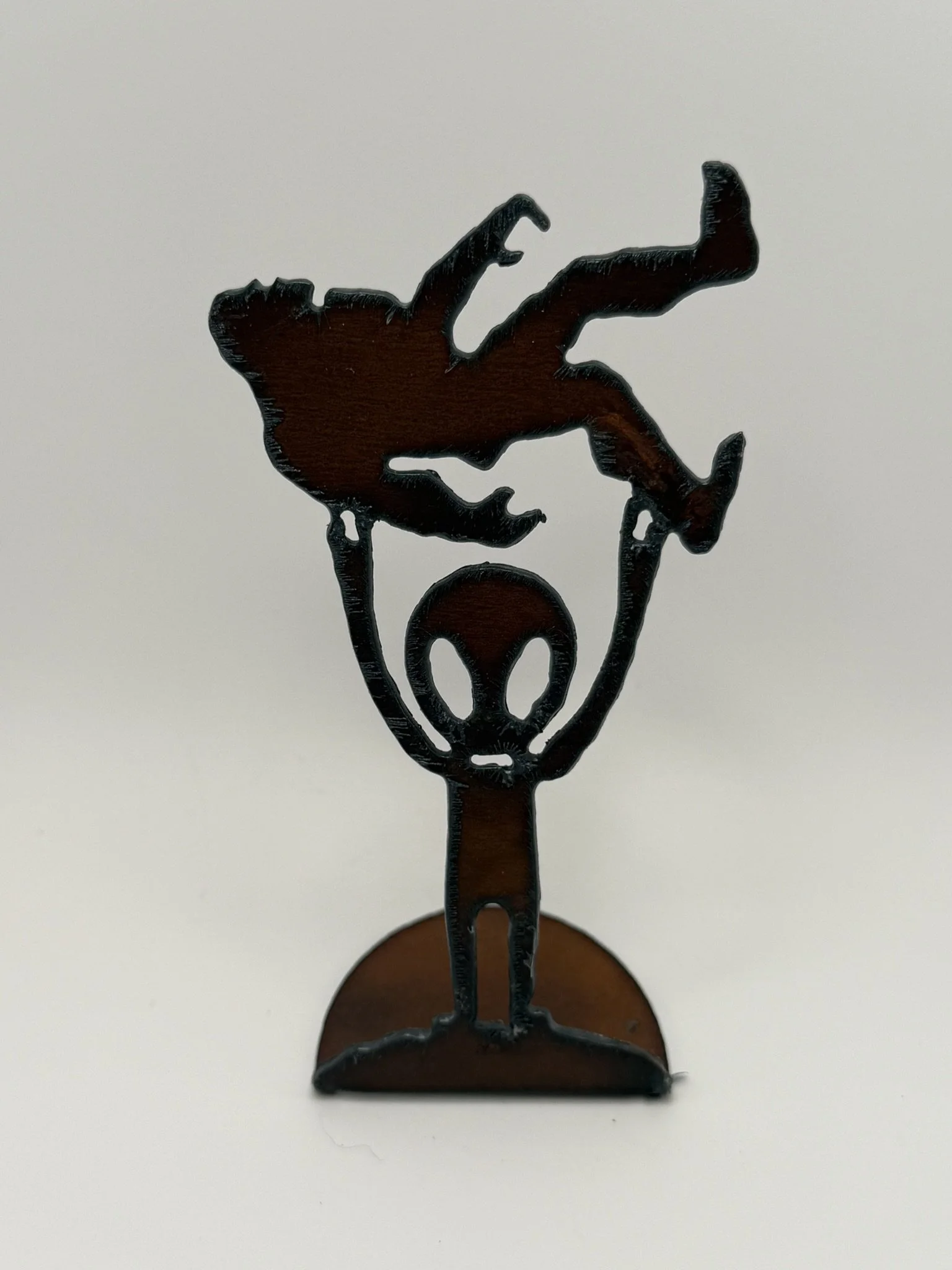 Locally Handcrafted Iron Art: Alien Holding Bigfoot