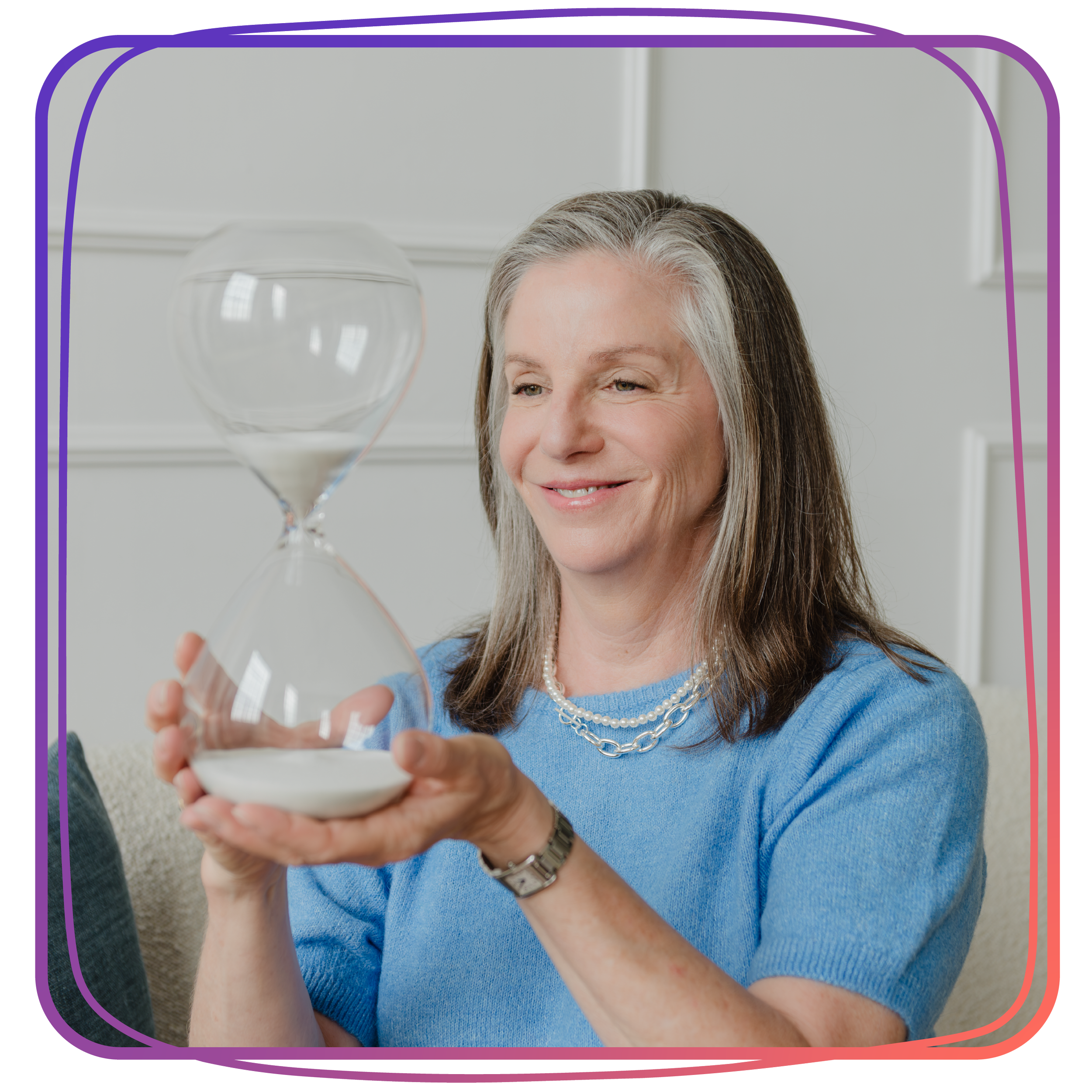Wendy Shami holding an hourglass.