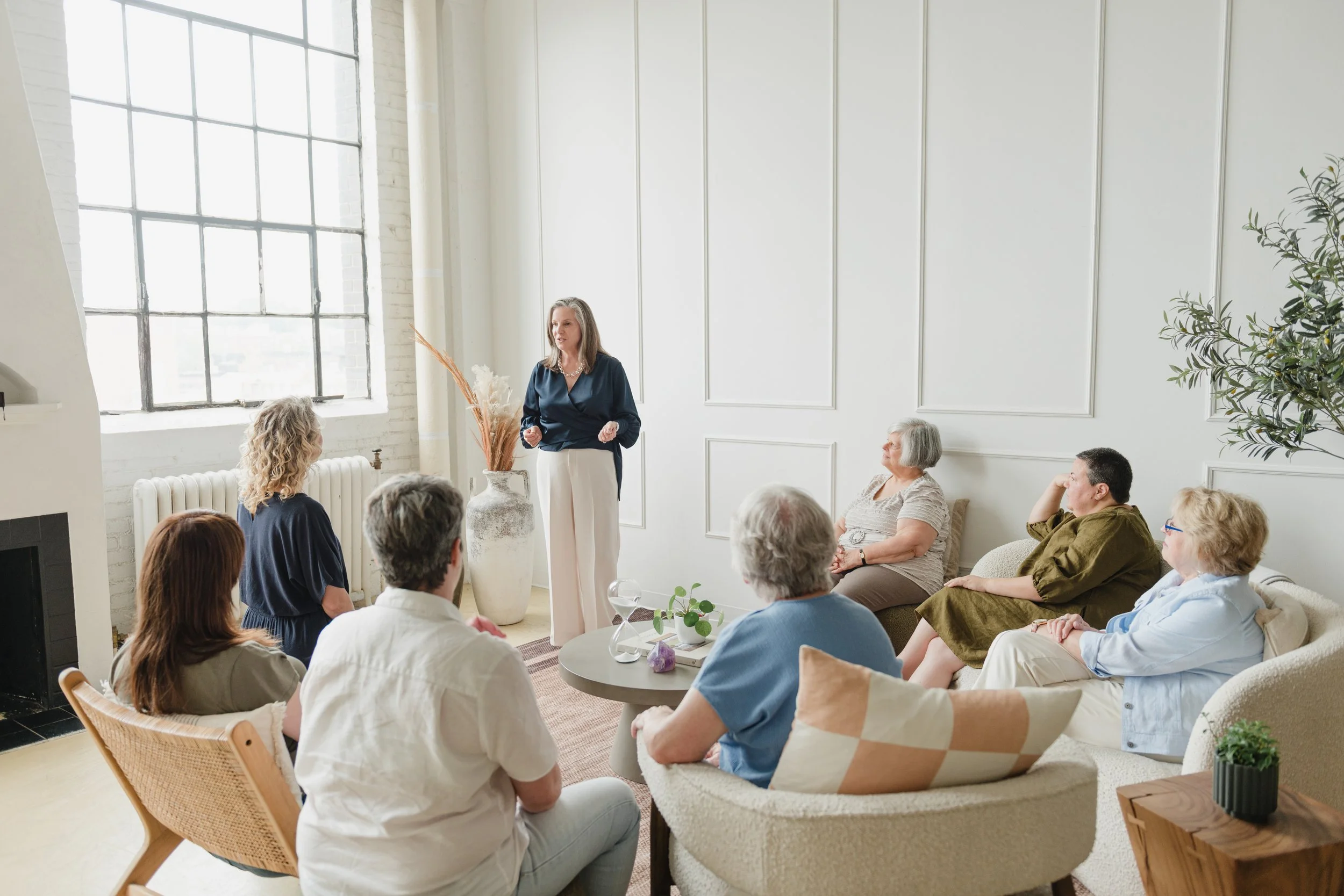 Wendy Shami delivering her Befriend Aging Workshop  to a small group of middle-aged and elderly adults.