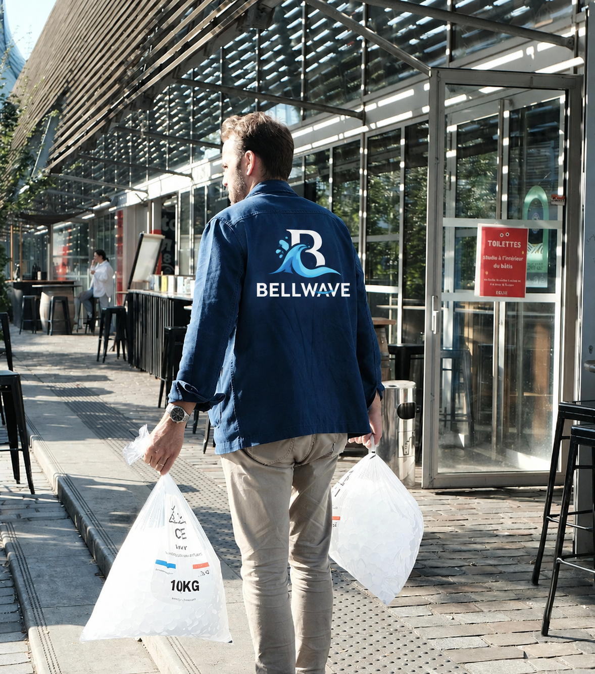 Man Carrying Bags of Ice