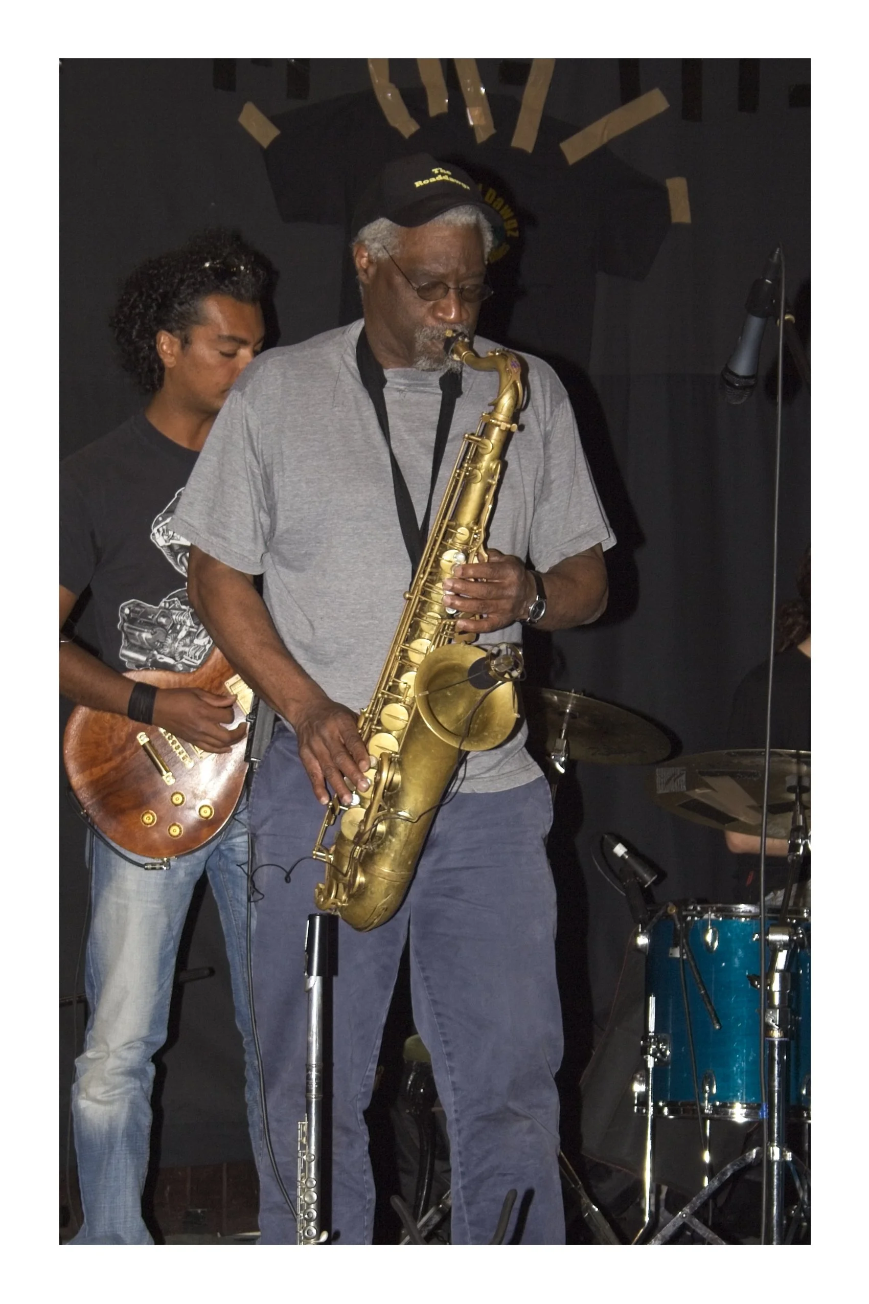 A saxophonist playing in a band