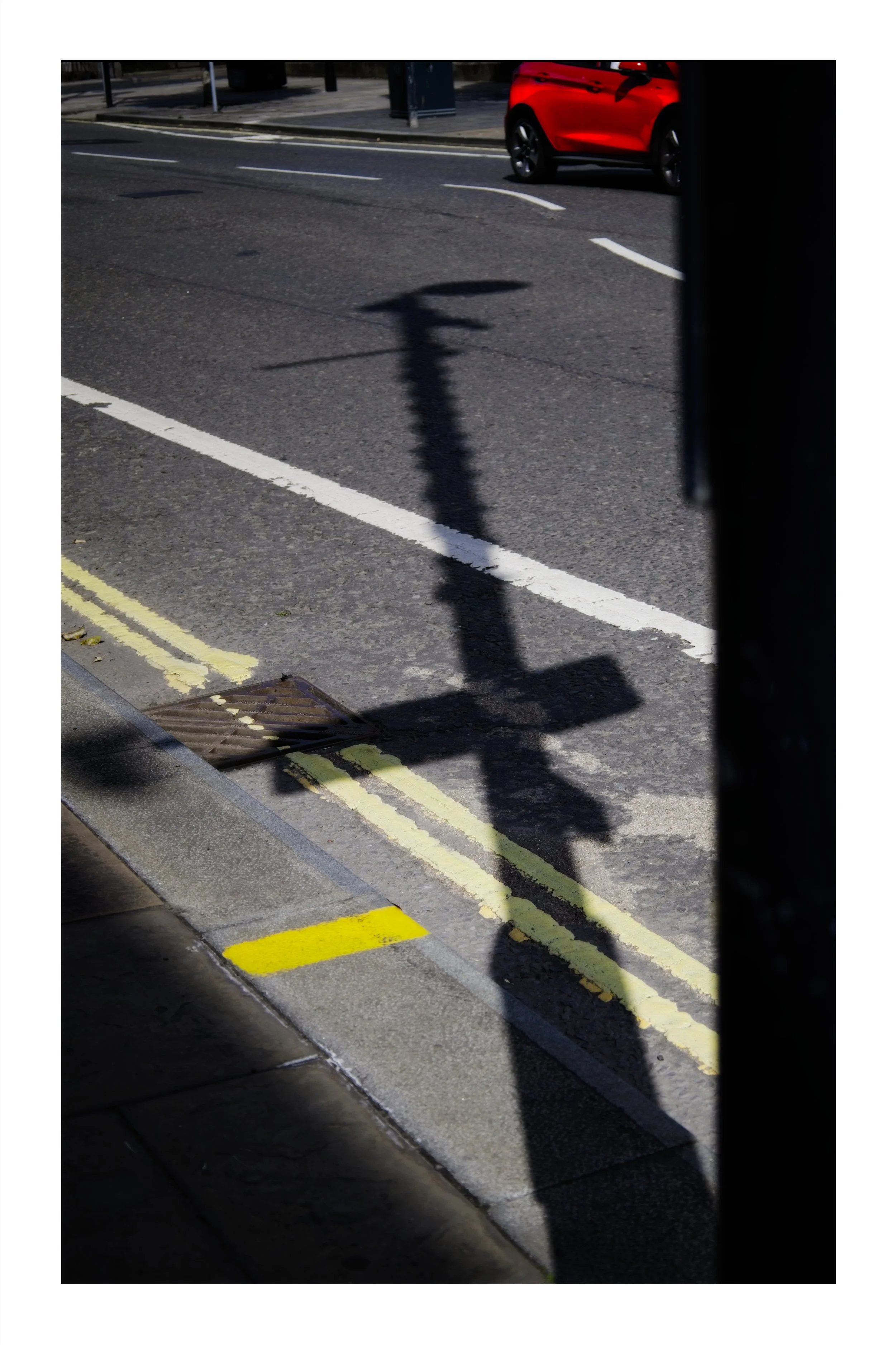 The shadow of a lamppost