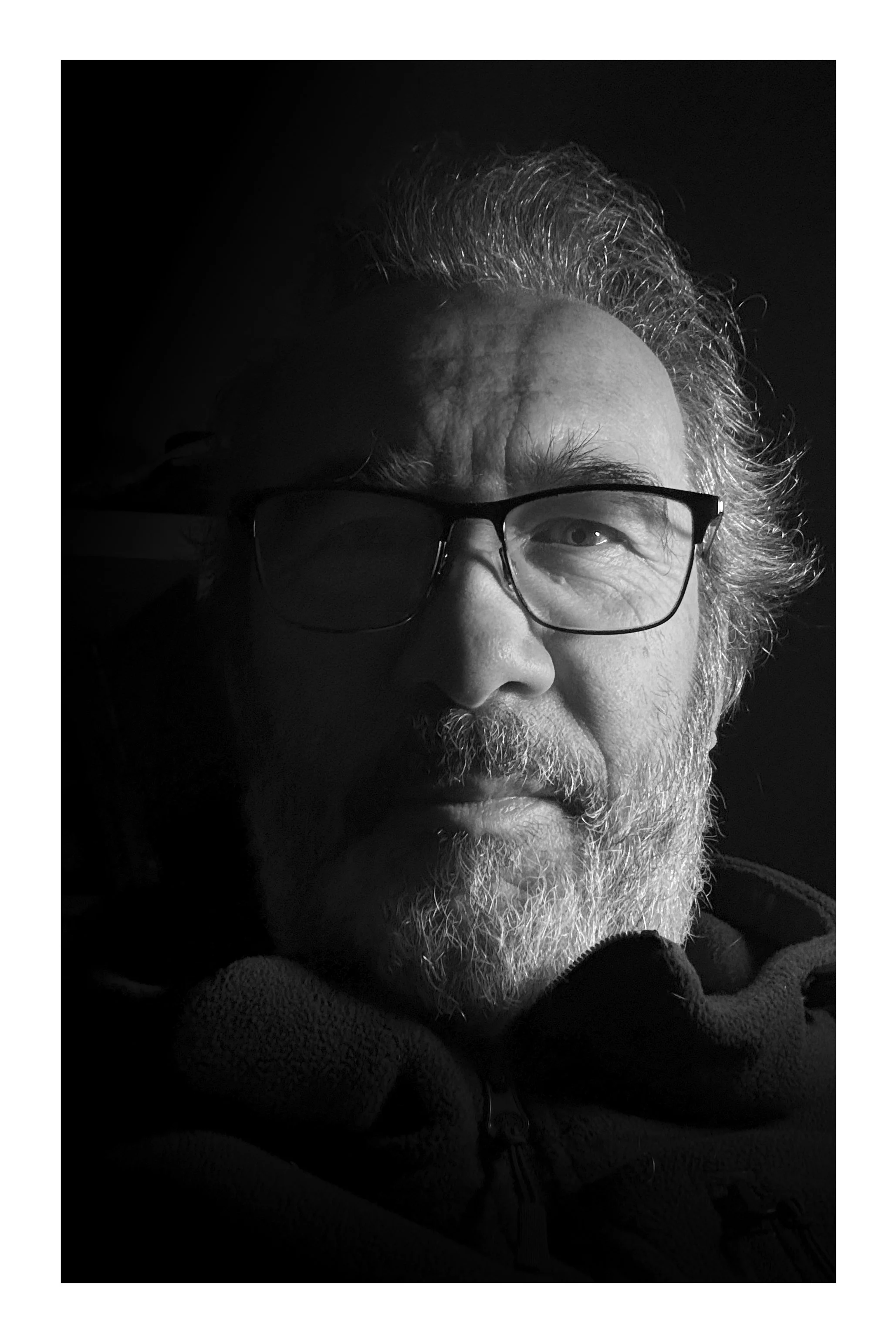A man with a beard looking at the camera