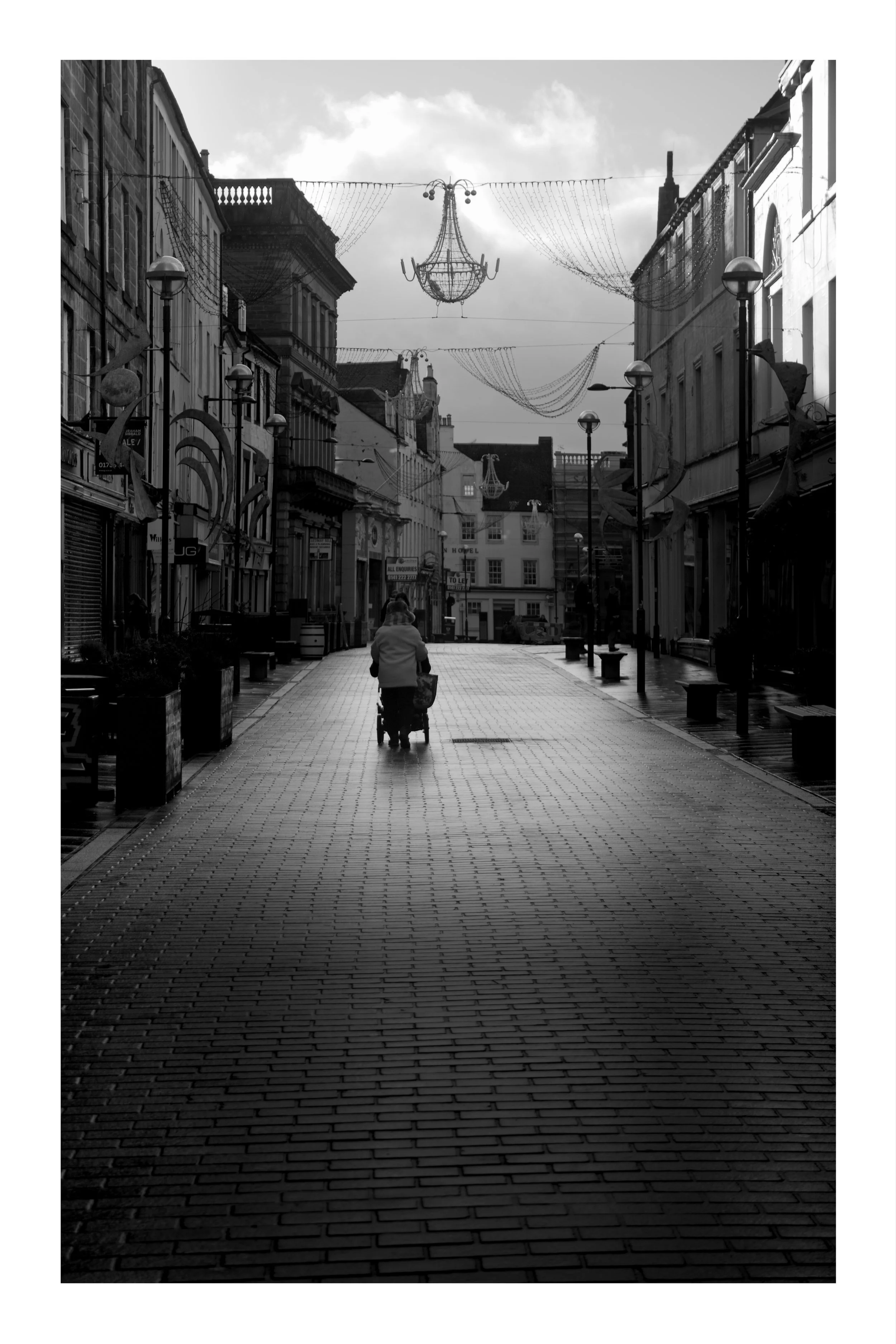 A woman pushing a pram in Perth, Scotland