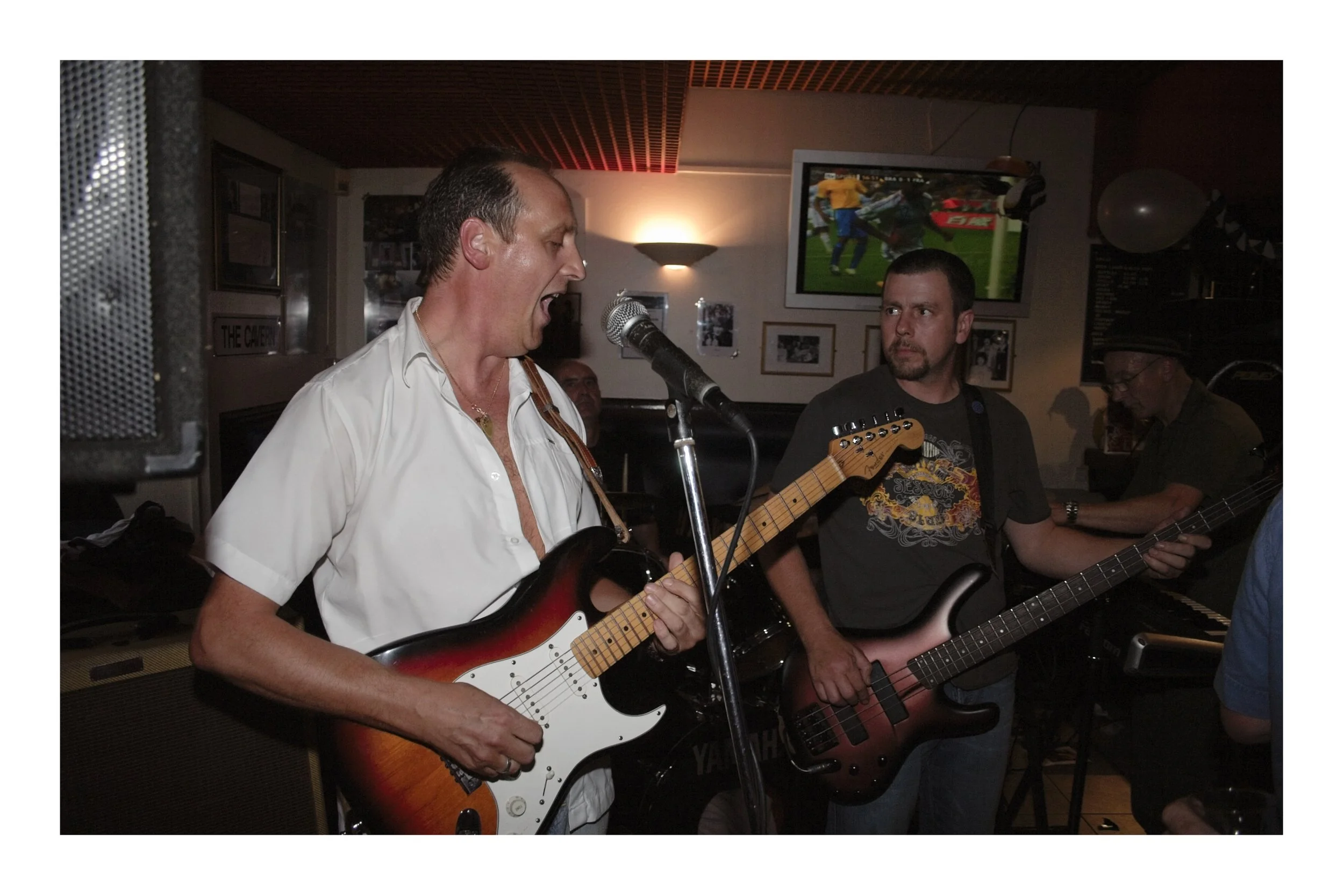 A guitarist playing in a band