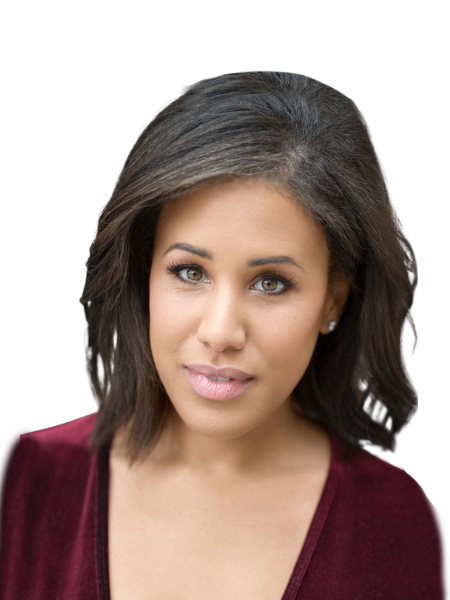 A woman with shoulder-length dark hair, wearing a maroon top, looking directly at the camera.