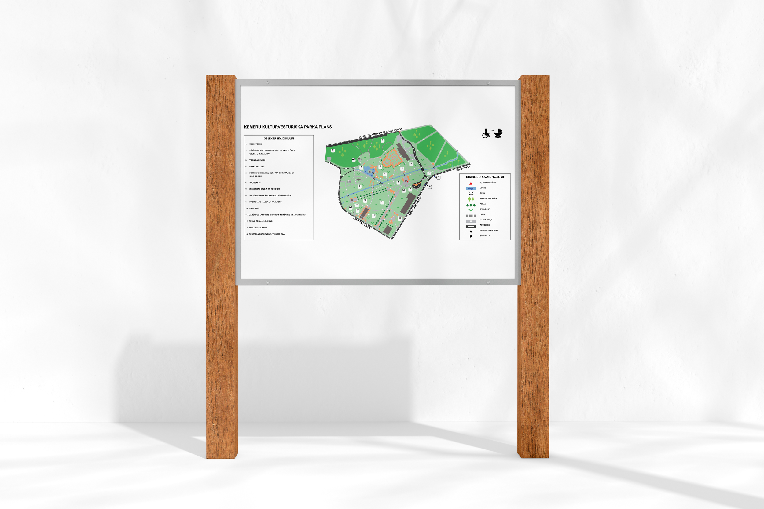 Park map and legend mounted on a wooden stand, showing paths, facilities, and symbols for accessibility and amenities.