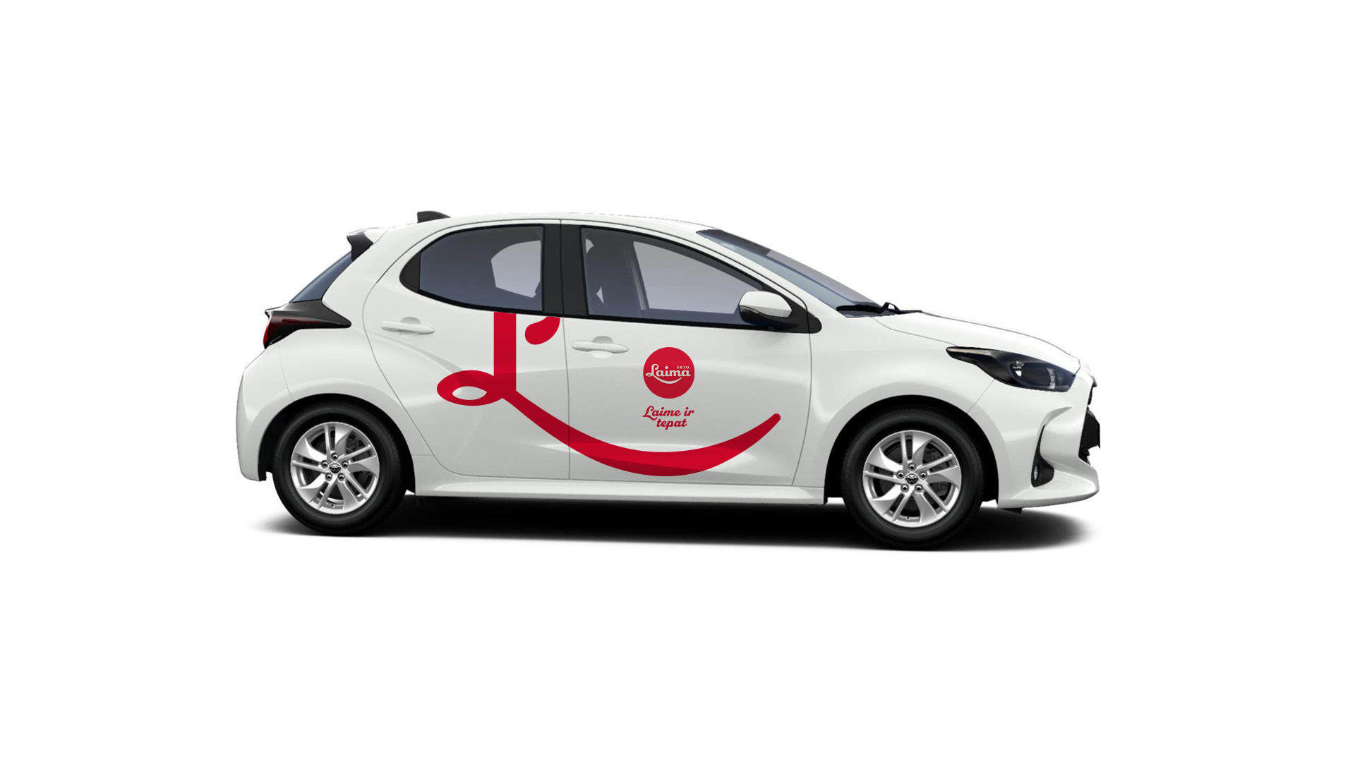White compact car with red smiley face design and text in a foreign language on the side.
