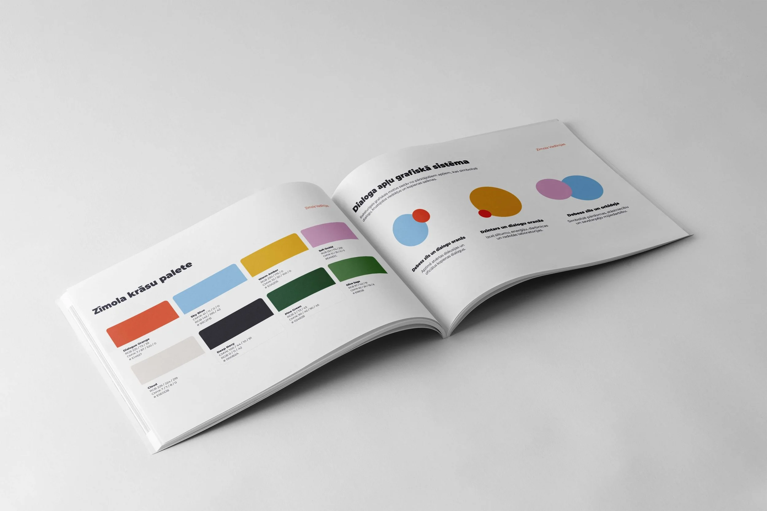 Open color swatch book showing various color palettes with text in a different language on white background.