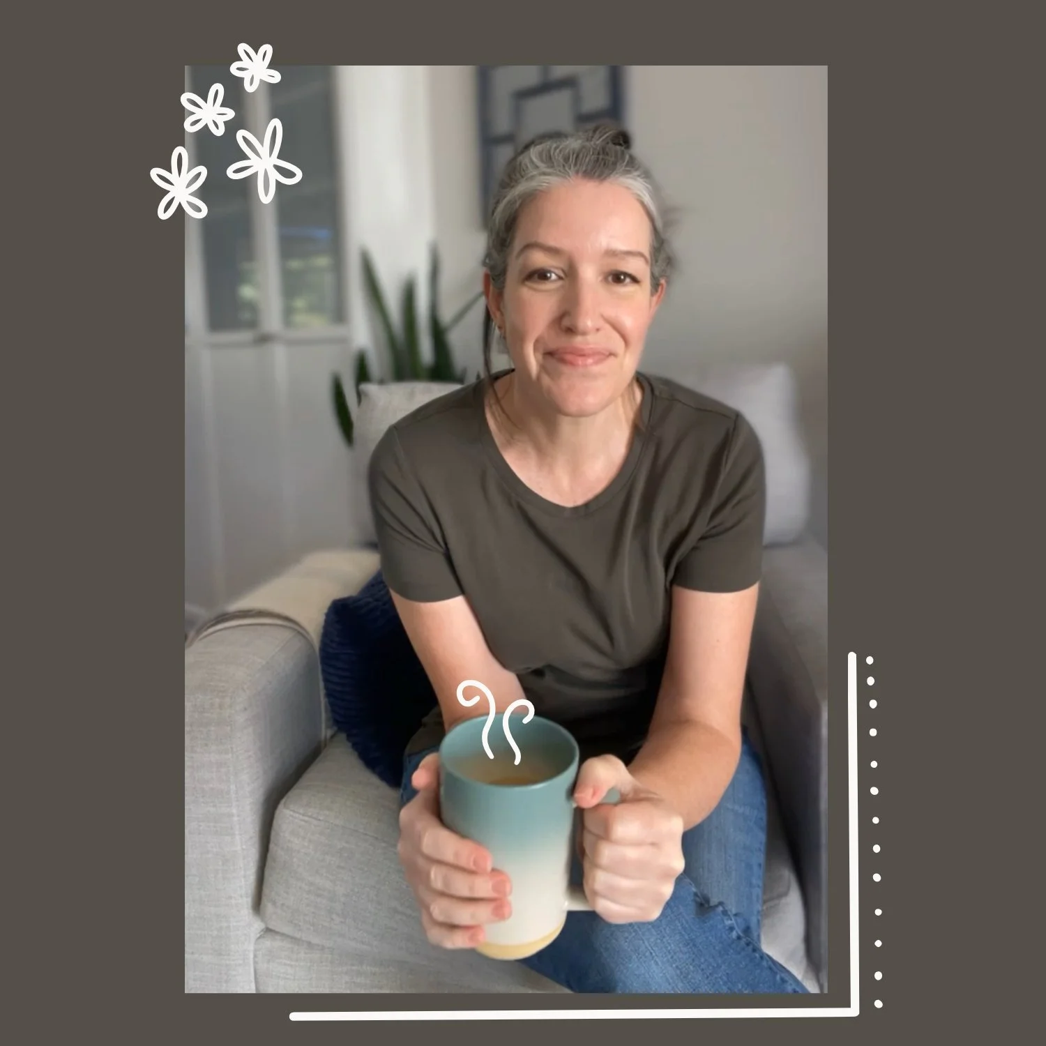A photo of Michelle sitting on a couch, holding a steaming cup of coffee, smiling at the camera.