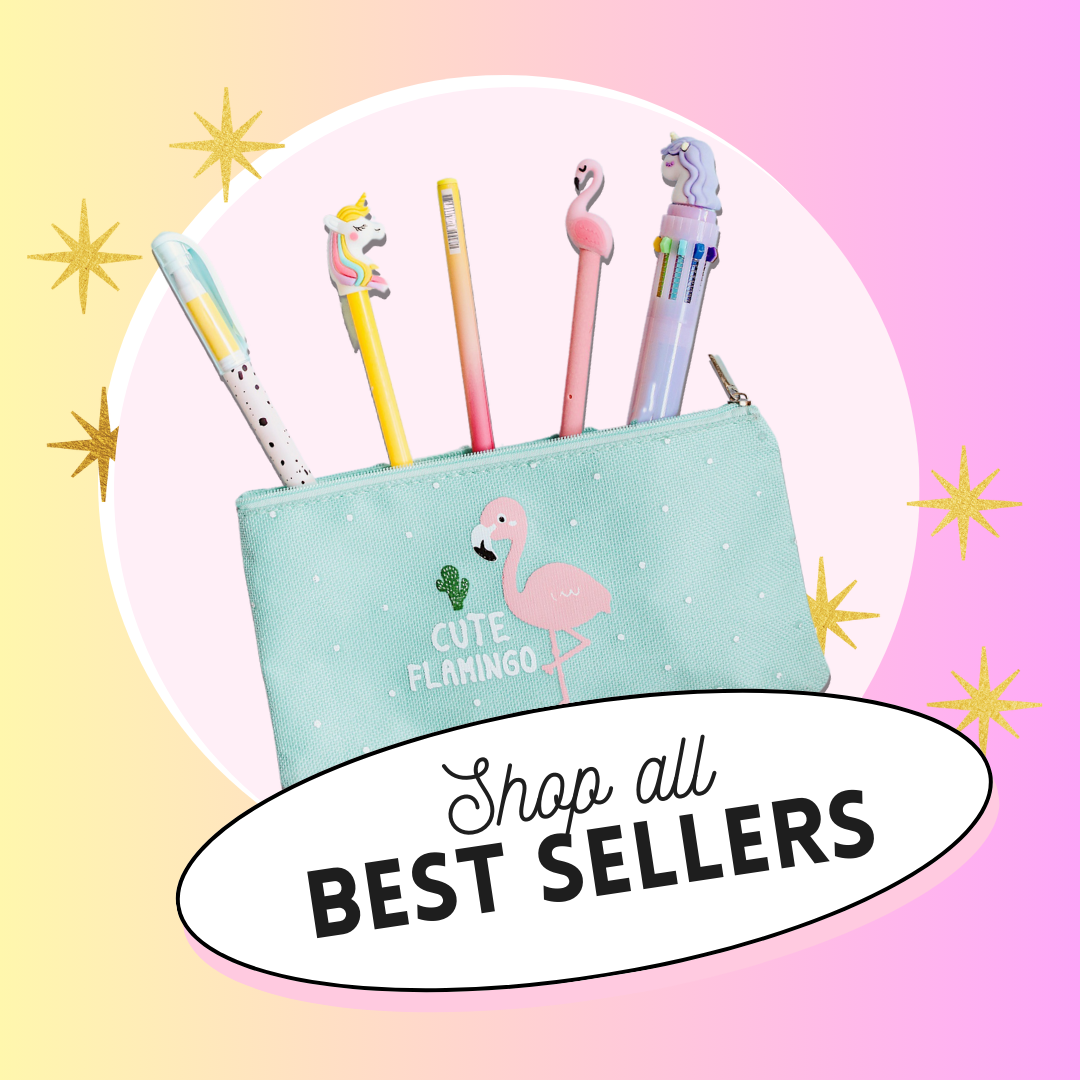 A light blue pencil case decorated with a pink flamingo and green cactus, with five pens featuring unicorns, a flamingo, and colorful caps, set against a pink background with gold stars and a white oval containing the text 'Shop all BEST SELLERS'.
