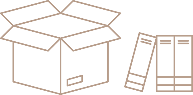 Open cardboard box with packing flaps raised, and a few books leaning against it.