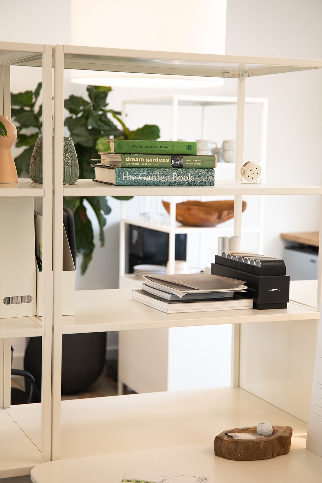 Studio shelves with garden books and design references