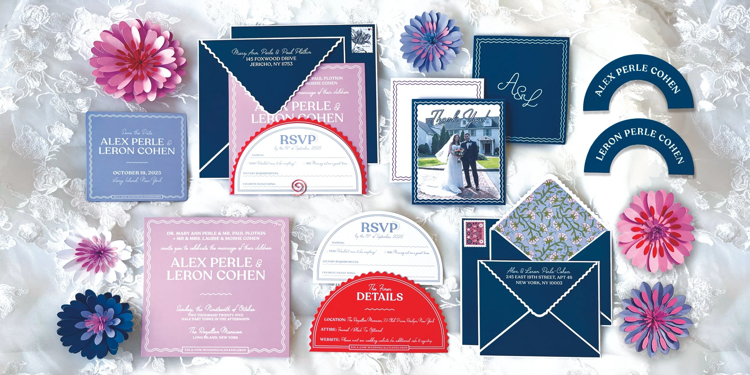 Wedding invitation suite including save-the-date cards, RSVP cards, thank you cards, and envelopes in navy blue, pink, and white, decorated with paper flowers and lace fabric background.