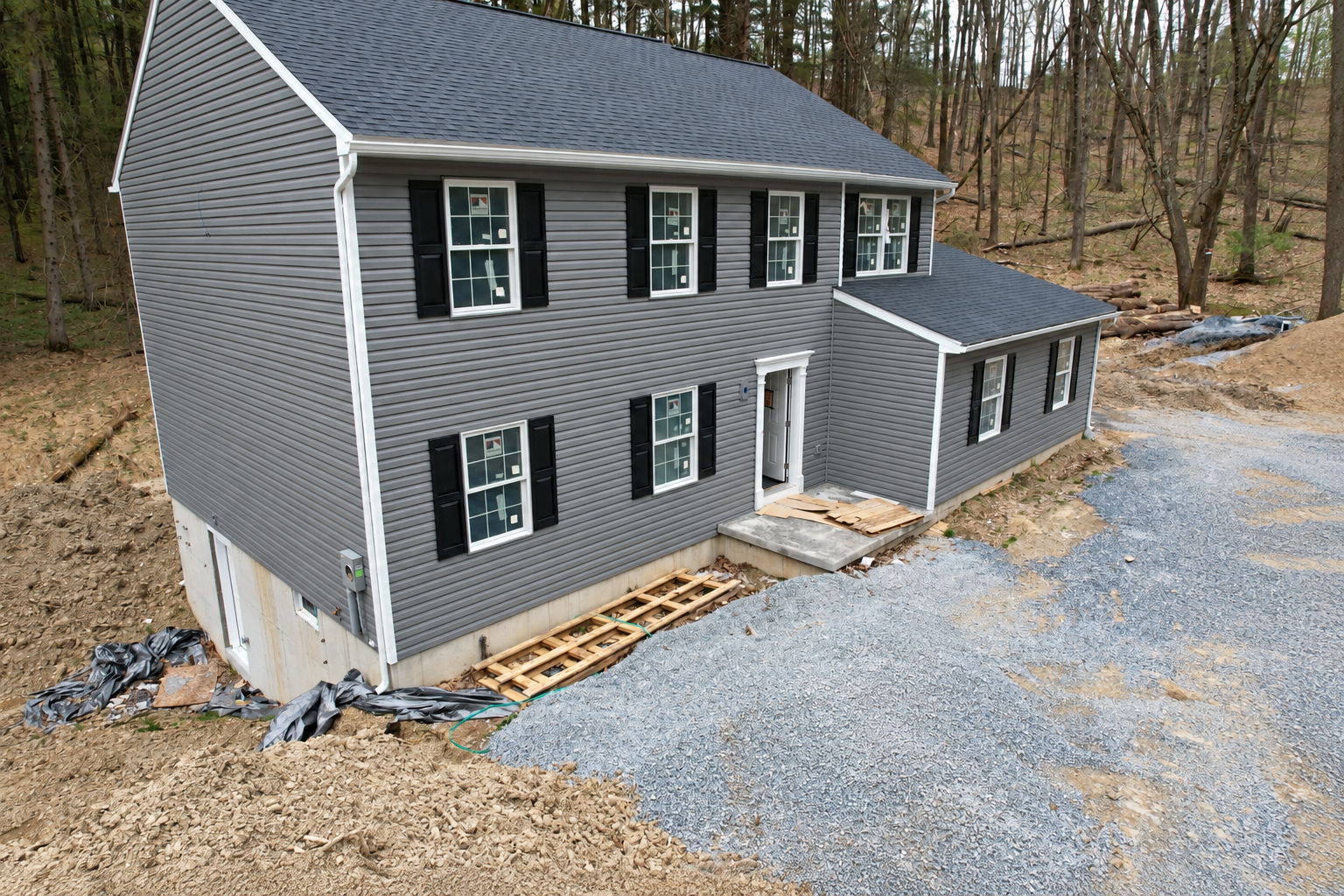 New Gray Home in a Woodland Clearing.png