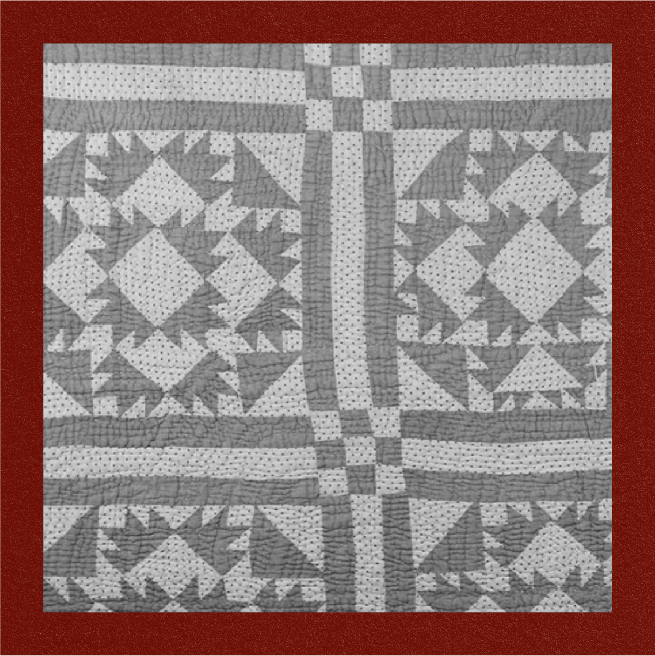 COTTON QUILT (1860-1930) - 
a homemade cotton quilt made of pieced blocks in the Bear Tracks pattern, utilizing hand and machine stitching