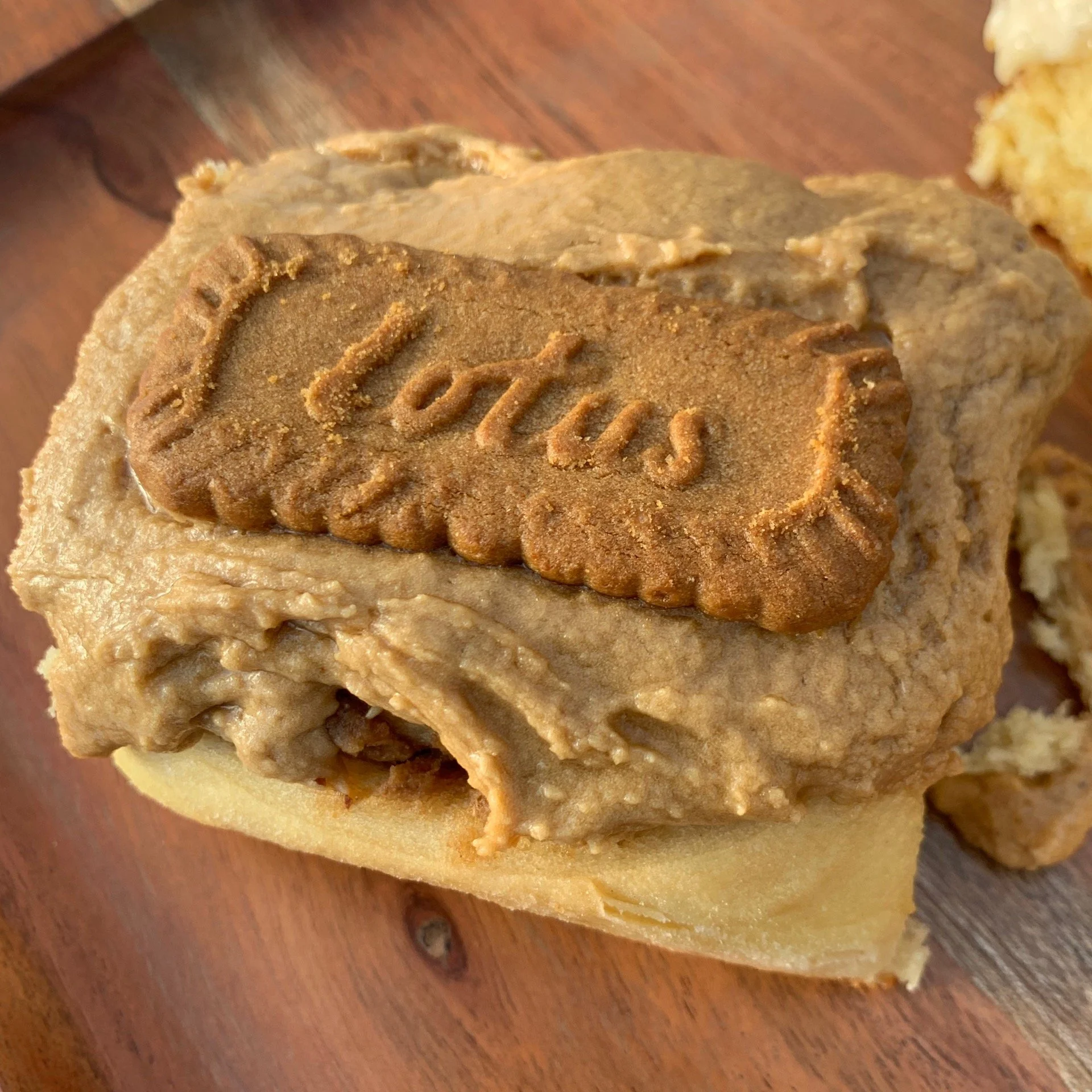 Biscoff Scroll with a wooden background