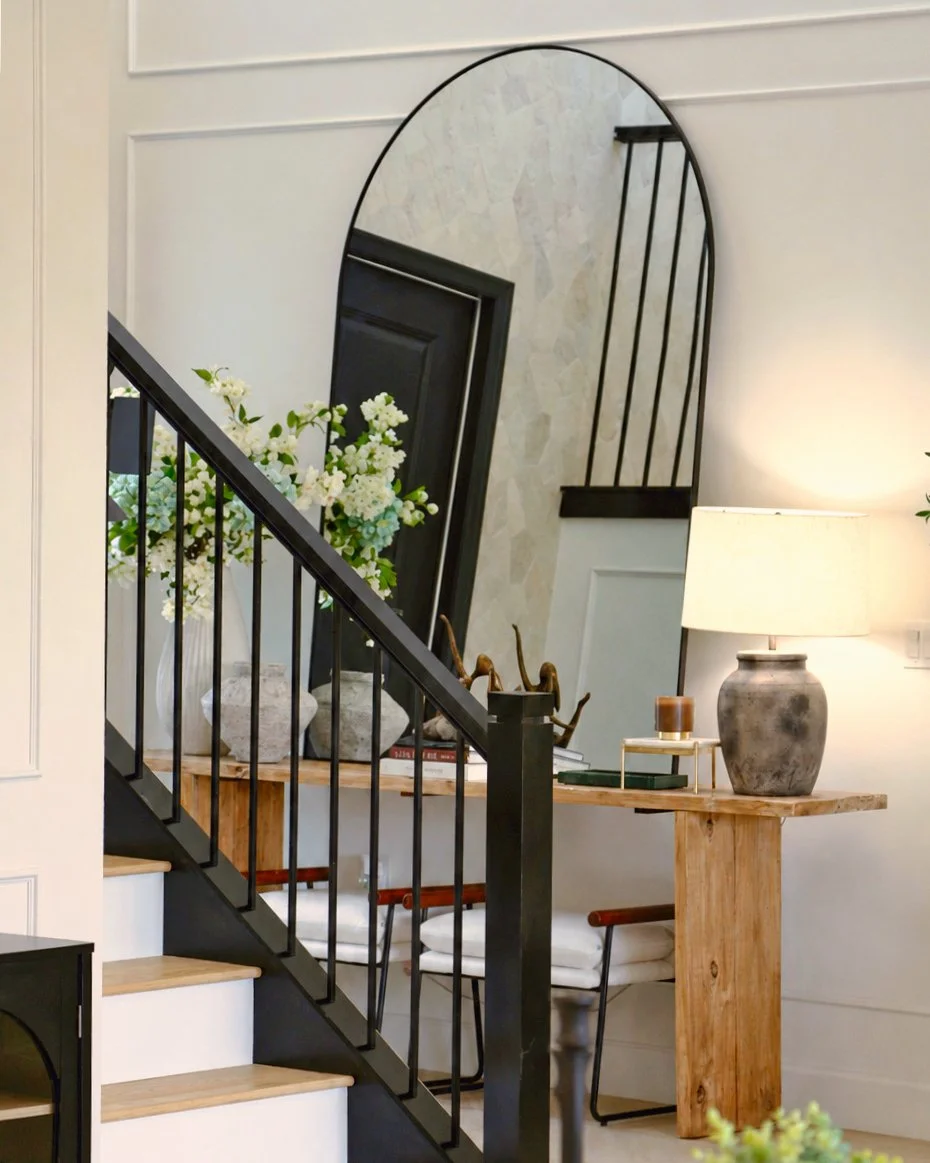 VISIONE URBANA_TURCONI ANDREA_Warm Staircase Interior with Arched Mirror.jpeg