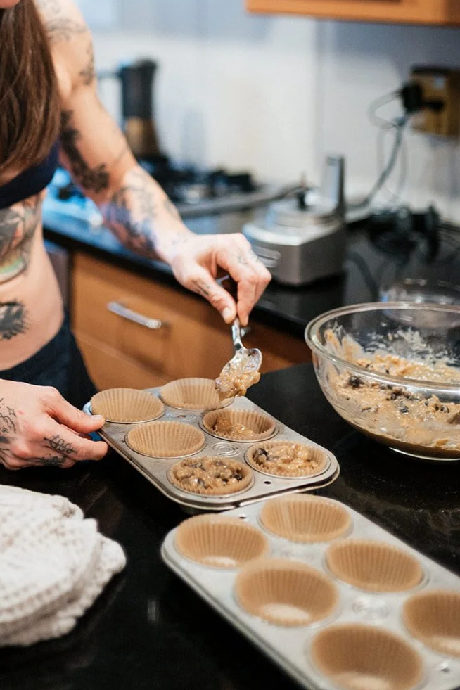 Cynthia Pokluda preparing a healthy meal, representing nutrition, lifestyle habits and practical health coaching.
