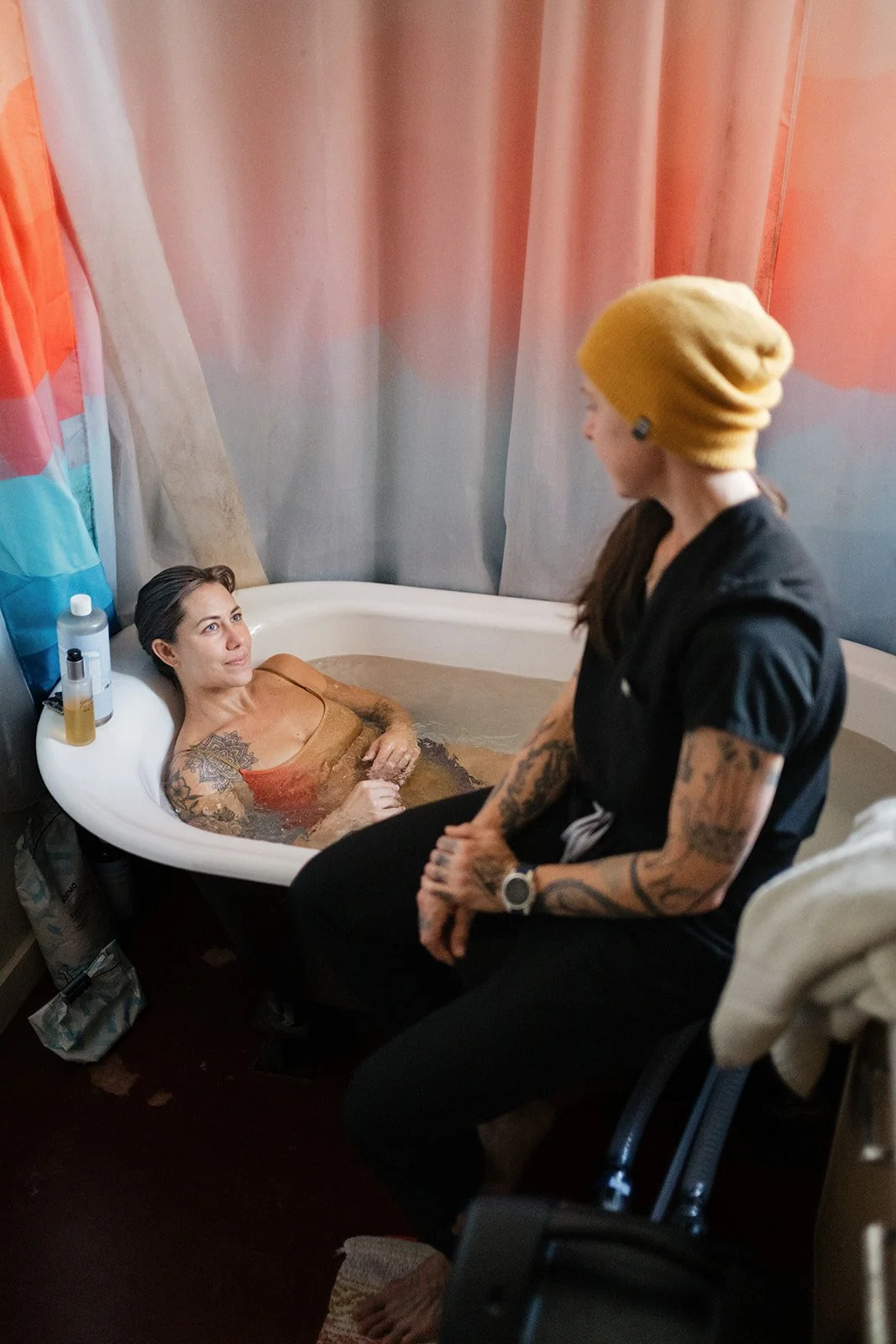 Wellness practitioner supporting a client during a relaxing therapeutic bath session with Bimini NanoJet
