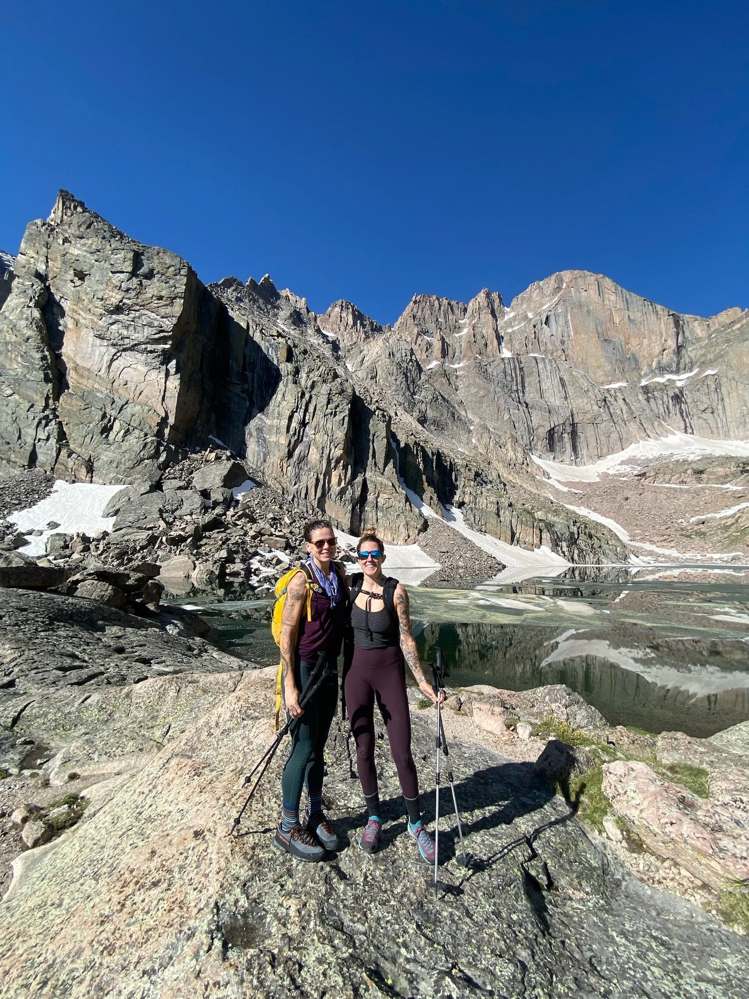 Two hikers enjoying an alpine mountain adventure, reflecting Rebel Medical’s focus on movement, vitality, exploration and healthy living.