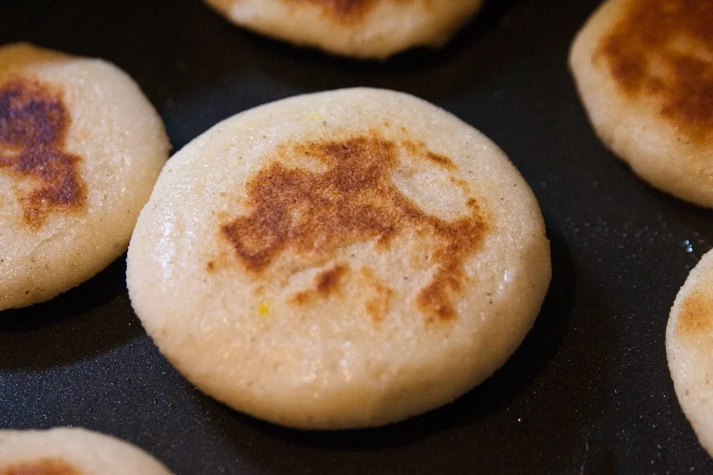 Traditional Colombian  golden-brown patties, called arepas